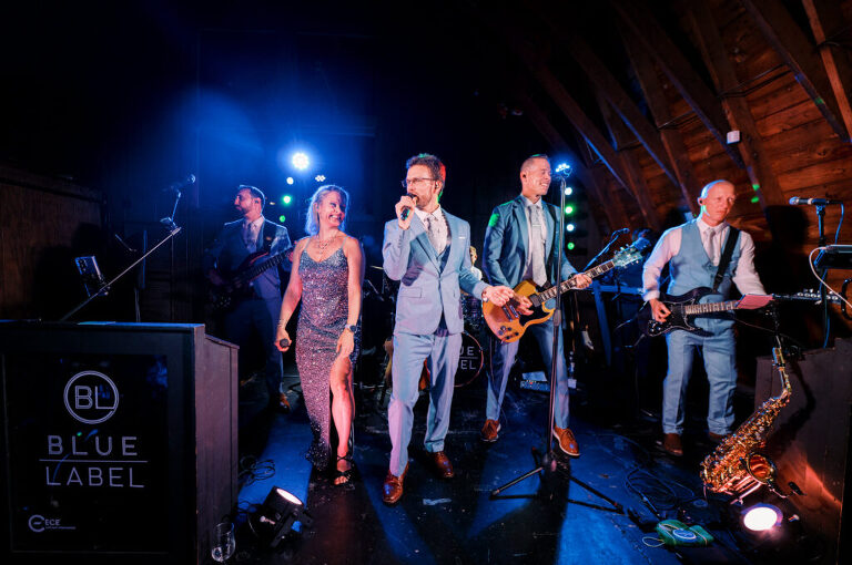 Malia and Aidan, currently residing in DC with their beloved pup Max, envisioned a wedding that reflected their laid-back, natural style. When we first chatted back in February 2023, they emphasized their desire for relaxed, fun, and candid photos that captured genuine moments. Choosing The Barn at Perona Farms was a perfect fit for Malia and Aidan. Nestled amidst charming rustic surroundings and abundant nature, the venue complemented their preference for an authentic and unposed wedding day experience. The ceremony took place outdoors on the lush lawn of The Barn at Perona Farms, exactly as they had envisioned – sweet, whimsy, and just the way they wanted it. Guests enjoyed a leisurely cocktail hour accompanied by live music courtesy of the talented Blue Label Band. The air was filled with the sounds of laughter and the clinking of wine glasses as everyone soaked in the joyful atmosphere. As the evening progressed upstairs at The Barn, the ambiance was transformed by Moonlit Acres' stunning floral arrangements, candles, and elegant drapes. The space slowly filled with guests, reconnecting and sharing stories, delighted to be together again. Then, the moment everyone had been waiting for: Malia and Aidan entered the room, surrounded by loved ones, and shared their first dance together. Malia and Aidan's The Barn at Perona Farms NJ wedding documented by by Karis | Hey Karis | Destination Wedding Photographer | Manhattan, Catskills, Hudson Valley, Brooklyn and NJ | Destination Elopement, Destination Wedding Photographer | Hey Karis is fun documentary wedding and elopement photographer based in NY, NJ.