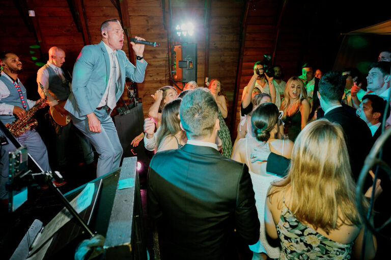 Malia and Aidan, currently residing in DC with their beloved pup Max, envisioned a wedding that reflected their laid-back, natural style. When we first chatted back in February 2023, they emphasized their desire for relaxed, fun, and candid photos that captured genuine moments.
Choosing The Barn at Perona Farms was a perfect fit for Malia and Aidan. Nestled amidst charming rustic surroundings and abundant nature, the venue complemented their preference for an authentic and unposed wedding day experience.
The ceremony took place outdoors on the lush lawn of The Barn at Perona Farms, exactly as they had envisioned – sweet, whimsy, and just the way they wanted it. Guests enjoyed a leisurely cocktail hour accompanied by live music courtesy of the talented Blue Label Band. The air was filled with the sounds of laughter and the clinking of wine glasses as everyone soaked in the joyful atmosphere.
As the evening progressed upstairs at The Barn, the ambiance was transformed by Moonlit Acres' stunning floral arrangements, candles, and elegant drapes. The space slowly filled with guests, reconnecting and sharing stories, delighted to be together again.
Then, the moment everyone had been waiting for: Malia and Aidan entered the room, surrounded by loved ones, and shared their first dance together.
Malia and Aidan's The Barn at Perona Farms NJ wedding documented by by Karis | Hey Karis | Destination Wedding Photographer | Manhattan, Catskills, Hudson Valley, Brooklyn and NJ | Destination Elopement, Destination Wedding Photographer | Hey Karis is fun documentary wedding and elopement photographer based in NY, NJ.