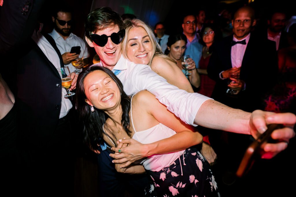 Malia and Aidan, currently residing in DC with their beloved pup Max, envisioned a wedding that reflected their laid-back, natural style. When we first chatted back in February 2023, they emphasized their desire for relaxed, fun, and candid photos that captured genuine moments.
Choosing The Barn at Perona Farms was a perfect fit for Malia and Aidan. Nestled amidst charming rustic surroundings and abundant nature, the venue complemented their preference for an authentic and unposed wedding day experience.
The ceremony took place outdoors on the lush lawn of The Barn at Perona Farms, exactly as they had envisioned – sweet, whimsy, and just the way they wanted it. Guests enjoyed a leisurely cocktail hour accompanied by live music courtesy of the talented Blue Label Band. The air was filled with the sounds of laughter and the clinking of wine glasses as everyone soaked in the joyful atmosphere.
As the evening progressed upstairs at The Barn, the ambiance was transformed by Moonlit Acres' stunning floral arrangements, candles, and elegant drapes. The space slowly filled with guests, reconnecting and sharing stories, delighted to be together again.
Then, the moment everyone had been waiting for: Malia and Aidan entered the room, surrounded by loved ones, and shared their first dance together.
Malia and Aidan's The Barn at Perona Farms NJ wedding documented by by Karis | Hey Karis | Destination Wedding Photographer | Manhattan, Catskills, Hudson Valley, Brooklyn and NJ | Destination Elopement, Destination Wedding Photographer | Hey Karis is fun documentary wedding and elopement photographer based in NY, NJ.