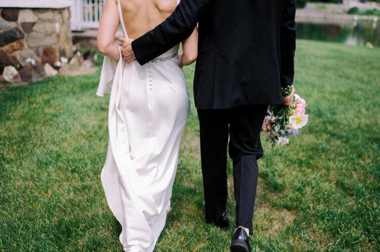 Malia and Aidan, currently residing in DC with their beloved pup Max, envisioned a wedding that reflected their laid-back, natural style. When we first chatted back in February 2023, they emphasized their desire for relaxed, fun, and candid photos that captured genuine moments.
Choosing The Barn at Perona Farms was a perfect fit for Malia and Aidan. Nestled amidst charming rustic surroundings and abundant nature, the venue complemented their preference for an authentic and unposed wedding day experience.
The ceremony took place outdoors on the lush lawn of The Barn at Perona Farms, exactly as they had envisioned – sweet, whimsy, and just the way they wanted it. Guests enjoyed a leisurely cocktail hour accompanied by live music courtesy of the talented Blue Label Band. The air was filled with the sounds of laughter and the clinking of wine glasses as everyone soaked in the joyful atmosphere.
As the evening progressed upstairs at The Barn, the ambiance was transformed by Moonlit Acres' stunning floral arrangements, candles, and elegant drapes. The space slowly filled with guests, reconnecting and sharing stories, delighted to be together again.
Then, the moment everyone had been waiting for: Malia and Aidan entered the room, surrounded by loved ones, and shared their first dance together.
Malia and Aidan's The Barn at Perona Farms NJ wedding documented by by Karis | Hey Karis | Destination Wedding Photographer | Manhattan, Catskills, Hudson Valley, Brooklyn and NJ | Destination Elopement, Destination Wedding Photographer | Hey Karis is fun documentary wedding and elopement photographer based in NY, NJ.