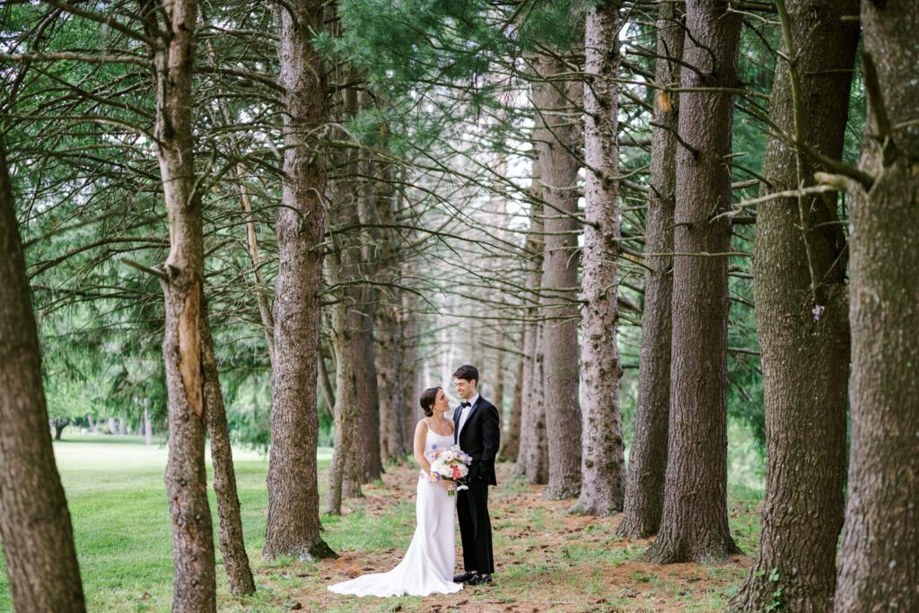 Malia and Aidan, currently residing in DC with their beloved pup Max, envisioned a wedding that reflected their laid-back, natural style. When we first chatted back in February 2023, they emphasized their desire for relaxed, fun, and candid photos that captured genuine moments.
Choosing The Barn at Perona Farms was a perfect fit for Malia and Aidan. Nestled amidst charming rustic surroundings and abundant nature, the venue complemented their preference for an authentic and unposed wedding day experience.
The ceremony took place outdoors on the lush lawn of The Barn at Perona Farms, exactly as they had envisioned – sweet, whimsy, and just the way they wanted it. Guests enjoyed a leisurely cocktail hour accompanied by live music courtesy of the talented Blue Label Band. The air was filled with the sounds of laughter and the clinking of wine glasses as everyone soaked in the joyful atmosphere.
As the evening progressed upstairs at The Barn, the ambiance was transformed by Moonlit Acres' stunning floral arrangements, candles, and elegant drapes. The space slowly filled with guests, reconnecting and sharing stories, delighted to be together again.
Then, the moment everyone had been waiting for: Malia and Aidan entered the room, surrounded by loved ones, and shared their first dance together.
Malia and Aidan's The Barn at Perona Farms NJ wedding documented by by Karis | Hey Karis | Destination Wedding Photographer | Manhattan, Catskills, Hudson Valley, Brooklyn and NJ | Destination Elopement, Destination Wedding Photographer | Hey Karis is fun documentary wedding and elopement photographer based in NY, NJ.