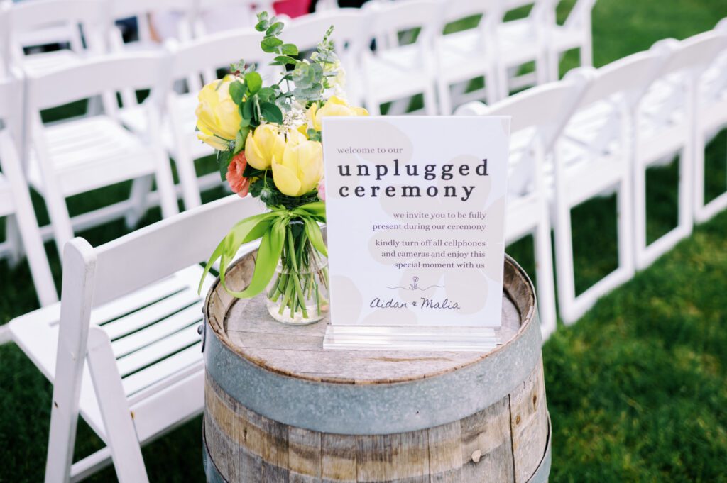 Malia and Aidan, currently residing in DC with their beloved pup Max, envisioned a wedding that reflected their laid-back, natural style. When we first chatted back in February 2023, they emphasized their desire for relaxed, fun, and candid photos that captured genuine moments.
Choosing The Barn at Perona Farms was a perfect fit for Malia and Aidan. Nestled amidst charming rustic surroundings and abundant nature, the venue complemented their preference for an authentic and unposed wedding day experience.
The ceremony took place outdoors on the lush lawn of The Barn at Perona Farms, exactly as they had envisioned – sweet, whimsy, and just the way they wanted it. Guests enjoyed a leisurely cocktail hour accompanied by live music courtesy of the talented Blue Label Band. The air was filled with the sounds of laughter and the clinking of wine glasses as everyone soaked in the joyful atmosphere.
As the evening progressed upstairs at The Barn, the ambiance was transformed by Moonlit Acres' stunning floral arrangements, candles, and elegant drapes. The space slowly filled with guests, reconnecting and sharing stories, delighted to be together again.
Then, the moment everyone had been waiting for: Malia and Aidan entered the room, surrounded by loved ones, and shared their first dance together.
Malia and Aidan's The Barn at Perona Farms NJ wedding documented by by Karis | Hey Karis | Destination Wedding Photographer | Manhattan, Catskills, Hudson Valley, Brooklyn and NJ | Destination Elopement, Destination Wedding Photographer | Hey Karis is fun documentary wedding and elopement photographer based in NY, NJ.