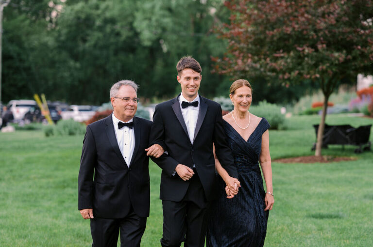 Malia and Aidan, currently residing in DC with their beloved pup Max, envisioned a wedding that reflected their laid-back, natural style. When we first chatted back in February 2023, they emphasized their desire for relaxed, fun, and candid photos that captured genuine moments.
Choosing The Barn at Perona Farms was a perfect fit for Malia and Aidan. Nestled amidst charming rustic surroundings and abundant nature, the venue complemented their preference for an authentic and unposed wedding day experience.
The ceremony took place outdoors on the lush lawn of The Barn at Perona Farms, exactly as they had envisioned – sweet, whimsy, and just the way they wanted it. Guests enjoyed a leisurely cocktail hour accompanied by live music courtesy of the talented Blue Label Band. The air was filled with the sounds of laughter and the clinking of wine glasses as everyone soaked in the joyful atmosphere.
As the evening progressed upstairs at The Barn, the ambiance was transformed by Moonlit Acres' stunning floral arrangements, candles, and elegant drapes. The space slowly filled with guests, reconnecting and sharing stories, delighted to be together again.
Then, the moment everyone had been waiting for: Malia and Aidan entered the room, surrounded by loved ones, and shared their first dance together.
Malia and Aidan's The Barn at Perona Farms NJ wedding documented by by Karis | Hey Karis | Destination Wedding Photographer | Manhattan, Catskills, Hudson Valley, Brooklyn and NJ | Destination Elopement, Destination Wedding Photographer | Hey Karis is fun documentary wedding and elopement photographer based in NY, NJ.