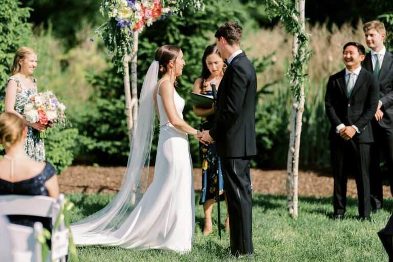 Malia and Aidan, currently residing in DC with their beloved pup Max, envisioned a wedding that reflected their laid-back, natural style. When we first chatted back in February 2023, they emphasized their desire for relaxed, fun, and candid photos that captured genuine moments.
Choosing The Barn at Perona Farms was a perfect fit for Malia and Aidan. Nestled amidst charming rustic surroundings and abundant nature, the venue complemented their preference for an authentic and unposed wedding day experience.
The ceremony took place outdoors on the lush lawn of The Barn at Perona Farms, exactly as they had envisioned – sweet, whimsy, and just the way they wanted it. Guests enjoyed a leisurely cocktail hour accompanied by live music courtesy of the talented Blue Label Band. The air was filled with the sounds of laughter and the clinking of wine glasses as everyone soaked in the joyful atmosphere.
As the evening progressed upstairs at The Barn, the ambiance was transformed by Moonlit Acres' stunning floral arrangements, candles, and elegant drapes. The space slowly filled with guests, reconnecting and sharing stories, delighted to be together again.
Then, the moment everyone had been waiting for: Malia and Aidan entered the room, surrounded by loved ones, and shared their first dance together.
Malia and Aidan's The Barn at Perona Farms NJ wedding documented by by Karis | Hey Karis | Destination Wedding Photographer | Manhattan, Catskills, Hudson Valley, Brooklyn and NJ | Destination Elopement, Destination Wedding Photographer | Hey Karis is fun documentary wedding and elopement photographer based in NY, NJ.