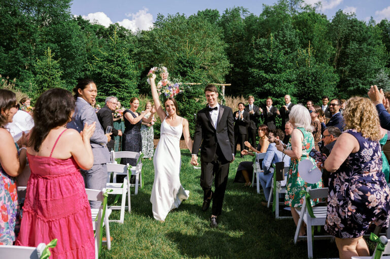 Malia and Aidan, currently residing in DC with their beloved pup Max, envisioned a wedding that reflected their laid-back, natural style. When we first chatted back in February 2023, they emphasized their desire for relaxed, fun, and candid photos that captured genuine moments.
Choosing The Barn at Perona Farms was a perfect fit for Malia and Aidan. Nestled amidst charming rustic surroundings and abundant nature, the venue complemented their preference for an authentic and unposed wedding day experience.
The ceremony took place outdoors on the lush lawn of The Barn at Perona Farms, exactly as they had envisioned – sweet, whimsy, and just the way they wanted it. Guests enjoyed a leisurely cocktail hour accompanied by live music courtesy of the talented Blue Label Band. The air was filled with the sounds of laughter and the clinking of wine glasses as everyone soaked in the joyful atmosphere.
As the evening progressed upstairs at The Barn, the ambiance was transformed by Moonlit Acres' stunning floral arrangements, candles, and elegant drapes. The space slowly filled with guests, reconnecting and sharing stories, delighted to be together again.
Then, the moment everyone had been waiting for: Malia and Aidan entered the room, surrounded by loved ones, and shared their first dance together.
Malia and Aidan's The Barn at Perona Farms NJ wedding documented by by Karis | Hey Karis | Destination Wedding Photographer | Manhattan, Catskills, Hudson Valley, Brooklyn and NJ | Destination Elopement, Destination Wedding Photographer | Hey Karis is fun documentary wedding and elopement photographer based in NY, NJ.