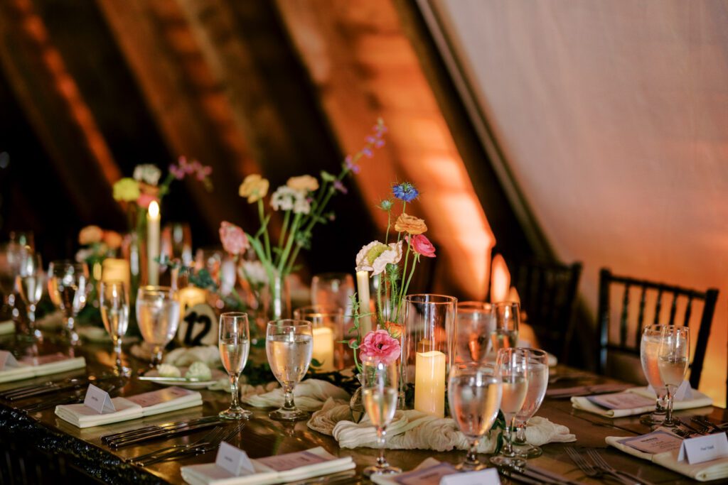 Malia and Aidan, currently residing in DC with their beloved pup Max, envisioned a wedding that reflected their laid-back, natural style. When we first chatted back in February 2023, they emphasized their desire for relaxed, fun, and candid photos that captured genuine moments.
Choosing The Barn at Perona Farms was a perfect fit for Malia and Aidan. Nestled amidst charming rustic surroundings and abundant nature, the venue complemented their preference for an authentic and unposed wedding day experience.
The ceremony took place outdoors on the lush lawn of The Barn at Perona Farms, exactly as they had envisioned – sweet, whimsy, and just the way they wanted it. Guests enjoyed a leisurely cocktail hour accompanied by live music courtesy of the talented Blue Label Band. The air was filled with the sounds of laughter and the clinking of wine glasses as everyone soaked in the joyful atmosphere.
As the evening progressed upstairs at The Barn, the ambiance was transformed by Moonlit Acres' stunning floral arrangements, candles, and elegant drapes. The space slowly filled with guests, reconnecting and sharing stories, delighted to be together again.
Then, the moment everyone had been waiting for: Malia and Aidan entered the room, surrounded by loved ones, and shared their first dance together.
Malia and Aidan's The Barn at Perona Farms NJ wedding documented by by Karis | Hey Karis | Destination Wedding Photographer | Manhattan, Catskills, Hudson Valley, Brooklyn and NJ | Destination Elopement, Destination Wedding Photographer | Hey Karis is fun documentary wedding and elopement photographer based in NY, NJ.