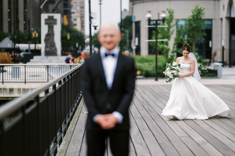 I first connected with Rachel through a DM on Instagram. From that initial message, our conversations quickly evolved, and soon I was part of her wedding journey. Rachel's bright, bubbly personality shone through as she excitedly shared stories about her and Zach, including his proposal. When I met them for their engagement session in the Meatpacking District of New York City, it was clear they were made for each other. The way Zach’s eyes lit up when he looked at Rachel, and how their contrasting personalities complemented one another, was undeniable. It felt like hearts were falling from the sky that day.
Their wedding at Liberty House in Jersey City on June 30, 2024, was just as magical. All the love and emotions were on full display, and the excitement was palpable in the air. Both Rachel and Zach’s families were overjoyed to witness their children marry the loves of their lives. You could see it on their faces – pure happiness.
In keeping with Jewish tradition, Rachel and Zach held a beautiful Badeken and Ketubah signing, surrounded by their closest family and friends. Despite the rain, the ceremony was moved indoors at Liberty House, and thanks to the venue’s impressive panoramic windows, it still felt as if we were outside, with the stunning city skyline as our backdrop.
Rachel and Zach made their grand entrance into the reception with incredible energy, setting the tone for an evening filled with love, laughter, and celebration. The rest of the night was pure joy as their family and friends danced the night away, making unforgettable memories at Liberty House.
 Rachel and Zach Liberty House Jersey City NJ wedding documented by by Karis | Hey Karis | Destination Wedding Photographer | Manhattan, Catskills, Hudson Valley, Brooklyn and NJ | Destination Elopement, Destination Wedding Photographer | Hey Karis is fun documentary wedding and elopement photographer based in NY, NJ.