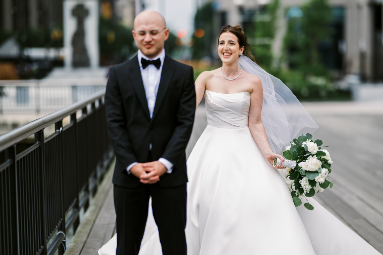 I first connected with Rachel through a DM on Instagram. From that initial message, our conversations quickly evolved, and soon I was part of her wedding journey. Rachel's bright, bubbly personality shone through as she excitedly shared stories about her and Zach, including his proposal. When I met them for their engagement session in the Meatpacking District of New York City, it was clear they were made for each other. The way Zach’s eyes lit up when he looked at Rachel, and how their contrasting personalities complemented one another, was undeniable. It felt like hearts were falling from the sky that day.
Their wedding at Liberty House in Jersey City on June 30, 2024, was just as magical. All the love and emotions were on full display, and the excitement was palpable in the air. Both Rachel and Zach’s families were overjoyed to witness their children marry the loves of their lives. You could see it on their faces – pure happiness.
In keeping with Jewish tradition, Rachel and Zach held a beautiful Badeken and Ketubah signing, surrounded by their closest family and friends. Despite the rain, the ceremony was moved indoors at Liberty House, and thanks to the venue’s impressive panoramic windows, it still felt as if we were outside, with the stunning city skyline as our backdrop.
Rachel and Zach made their grand entrance into the reception with incredible energy, setting the tone for an evening filled with love, laughter, and celebration. The rest of the night was pure joy as their family and friends danced the night away, making unforgettable memories at Liberty House.
 Rachel and Zach Liberty House Jersey City NJ wedding documented by by Karis | Hey Karis | Destination Wedding Photographer | Manhattan, Catskills, Hudson Valley, Brooklyn and NJ | Destination Elopement, Destination Wedding Photographer | Hey Karis is fun documentary wedding and elopement photographer based in NY, NJ.