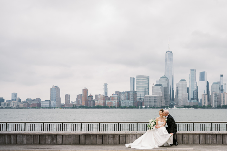 I first connected with Rachel through a DM on Instagram. From that initial message, our conversations quickly evolved, and soon I was part of her wedding journey. Rachel's bright, bubbly personality shone through as she excitedly shared stories about her and Zach, including his proposal. When I met them for their engagement session in the Meatpacking District of New York City, it was clear they were made for each other. The way Zach’s eyes lit up when he looked at Rachel, and how their contrasting personalities complemented one another, was undeniable. It felt like hearts were falling from the sky that day.
Their wedding at Liberty House in Jersey City on June 30, 2024, was just as magical. All the love and emotions were on full display, and the excitement was palpable in the air. Both Rachel and Zach’s families were overjoyed to witness their children marry the loves of their lives. You could see it on their faces – pure happiness.
In keeping with Jewish tradition, Rachel and Zach held a beautiful Badeken and Ketubah signing, surrounded by their closest family and friends. Despite the rain, the ceremony was moved indoors at Liberty House, and thanks to the venue’s impressive panoramic windows, it still felt as if we were outside, with the stunning city skyline as our backdrop.
Rachel and Zach made their grand entrance into the reception with incredible energy, setting the tone for an evening filled with love, laughter, and celebration. The rest of the night was pure joy as their family and friends danced the night away, making unforgettable memories at Liberty House.
 Rachel and Zach Liberty House Jersey City NJ wedding documented by by Karis | Hey Karis | Destination Wedding Photographer | Manhattan, Catskills, Hudson Valley, Brooklyn and NJ | Destination Elopement, Destination Wedding Photographer | Hey Karis is fun documentary wedding and elopement photographer based in NY, NJ.