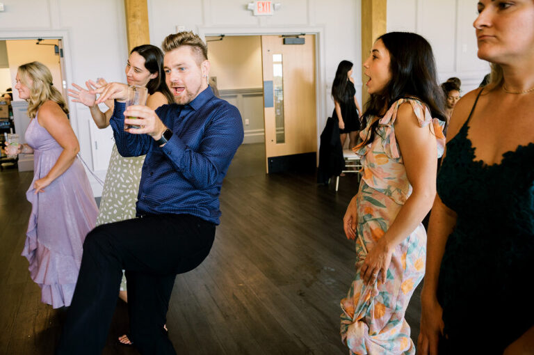 Leah and Kevin’s wedding was nothing short of enchanting—fitting for two fellow Harry Potter fans! From the emotional first look to their joyous celebration surrounded by family and friends, their special day was filled with love, laughter, and memorable moments.
Their day began early at The View at Lincoln Park, one of Jersey City’s newest and most unique wedding venues, part of the esteemed Landmark Venues collection. Nestled within the historic Lincoln Park, The View offers a modern yet timeless space with breathtaking scenery. The venue’s design is a stunning adaptive reuse of the original Lincoln Lodge (est. 1929), featuring preserved stone facades, timber beams, and antique fixtures. This blend of contemporary elegance and historic charm makes it a truly one-of-a-kind setting for weddings.
When I arrived, I was excited to explore the property and its surroundings. The View’s lush grounds, picturesque willow tree, and nearby landmarks, including the Lincoln Park Fountain, provide endless opportunities for stunning photographs. The morning was quiet as Leah and her bridesmaids arrived, carrying their dresses over their shoulders, and settled into the spacious bridal suite. Later, Kevin and their families arrived, and the anticipation began to build.
Leah and Kevin’s first look by the willow tree was a moment to remember. As the wind danced through the branches, tears filled Leah’s eyes as they read their vows to each other—an intimate, heartfelt exchange that perfectly set the tone for the day.
Guests began filling the chairs in Lincoln Room (the third-floor ceremony space), a modern area with large windows that allow natural light to flood in. This versatile room offers an elegant setting for ceremonies, with views of the surrounding park and cityscape. As Leah walked down the aisle with her father, they exchanged emotional glances, and the energy in the room was palpable.
The celebration moved to The Ballroom, The View’s stunning reception space. With its high ceilings, contemporary design, and floor-to-ceiling windows offering views of the park, the room was transformed into the perfect party atmosphere. Guests cheered as Leah and Kevin made their grand entrance, and their first dance kicked off an evening of fun, laughter, and memories.
Before the day concluded, Kevin had a special request for a photo by the Lincoln Park Fountain, a highlight of the park’s charm. We strolled over with Leah and Kevin to capture some magical portraits by the water. One of the great things about daytime weddings at The View is the ample natural light, ensuring we had beautiful lighting for photos even after the reception.
Leah and Kevin’s wedding was a joy to photograph, and The View at Lincoln Park provided the perfect backdrop for their unforgettable day. Congratulations to the happy couple—I’m so grateful to have been part of your story!
Leah and Kevin's The View at Lincoln Park Jersey City NJ documented by Karis from Hey Karis New York, Brooklyn, Hudson Valley NY and Catskills NY and NJ Wedding and NYC Elopement Photographer.
