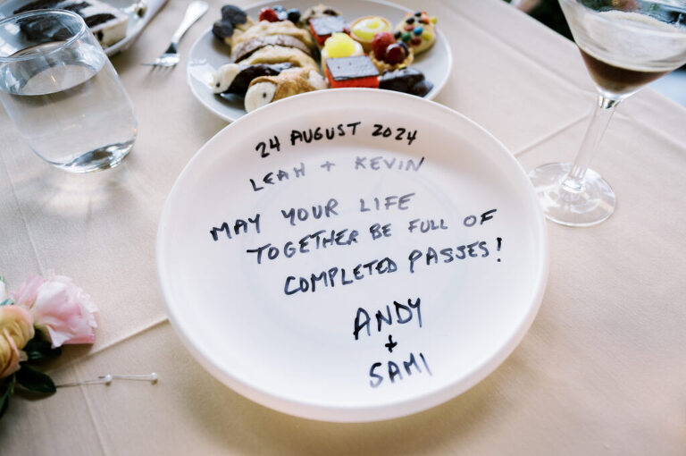 Leah and Kevin’s wedding was nothing short of enchanting—fitting for two fellow Harry Potter fans! From the emotional first look to their joyous celebration surrounded by family and friends, their special day was filled with love, laughter, and memorable moments.
Their day began early at The View at Lincoln Park, one of Jersey City’s newest and most unique wedding venues, part of the esteemed Landmark Venues collection. Nestled within the historic Lincoln Park, The View offers a modern yet timeless space with breathtaking scenery. The venue’s design is a stunning adaptive reuse of the original Lincoln Lodge (est. 1929), featuring preserved stone facades, timber beams, and antique fixtures. This blend of contemporary elegance and historic charm makes it a truly one-of-a-kind setting for weddings.
When I arrived, I was excited to explore the property and its surroundings. The View’s lush grounds, picturesque willow tree, and nearby landmarks, including the Lincoln Park Fountain, provide endless opportunities for stunning photographs. The morning was quiet as Leah and her bridesmaids arrived, carrying their dresses over their shoulders, and settled into the spacious bridal suite. Later, Kevin and their families arrived, and the anticipation began to build.
Leah and Kevin’s first look by the willow tree was a moment to remember. As the wind danced through the branches, tears filled Leah’s eyes as they read their vows to each other—an intimate, heartfelt exchange that perfectly set the tone for the day.
Guests began filling the chairs in Lincoln Room (the third-floor ceremony space), a modern area with large windows that allow natural light to flood in. This versatile room offers an elegant setting for ceremonies, with views of the surrounding park and cityscape. As Leah walked down the aisle with her father, they exchanged emotional glances, and the energy in the room was palpable.
The celebration moved to The Ballroom, The View’s stunning reception space. With its high ceilings, contemporary design, and floor-to-ceiling windows offering views of the park, the room was transformed into the perfect party atmosphere. Guests cheered as Leah and Kevin made their grand entrance, and their first dance kicked off an evening of fun, laughter, and memories.
Before the day concluded, Kevin had a special request for a photo by the Lincoln Park Fountain, a highlight of the park’s charm. We strolled over with Leah and Kevin to capture some magical portraits by the water. One of the great things about daytime weddings at The View is the ample natural light, ensuring we had beautiful lighting for photos even after the reception.
Leah and Kevin’s wedding was a joy to photograph, and The View at Lincoln Park provided the perfect backdrop for their unforgettable day. Congratulations to the happy couple—I’m so grateful to have been part of your story!
Leah and Kevin's The View at Lincoln Park Jersey City NJ documented by Karis from Hey Karis New York, Brooklyn, Hudson Valley NY and Catskills NY and NJ Wedding and NYC Elopement Photographer.
