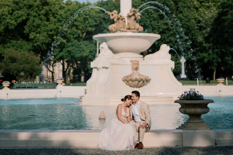 Leah and Kevin’s wedding was nothing short of enchanting—fitting for two fellow Harry Potter fans! From the emotional first look to their joyous celebration surrounded by family and friends, their special day was filled with love, laughter, and memorable moments.
Their day began early at The View at Lincoln Park, one of Jersey City’s newest and most unique wedding venues, part of the esteemed Landmark Venues collection. Nestled within the historic Lincoln Park, The View offers a modern yet timeless space with breathtaking scenery. The venue’s design is a stunning adaptive reuse of the original Lincoln Lodge (est. 1929), featuring preserved stone facades, timber beams, and antique fixtures. This blend of contemporary elegance and historic charm makes it a truly one-of-a-kind setting for weddings.
When I arrived, I was excited to explore the property and its surroundings. The View’s lush grounds, picturesque willow tree, and nearby landmarks, including the Lincoln Park Fountain, provide endless opportunities for stunning photographs. The morning was quiet as Leah and her bridesmaids arrived, carrying their dresses over their shoulders, and settled into the spacious bridal suite. Later, Kevin and their families arrived, and the anticipation began to build.
Leah and Kevin’s first look by the willow tree was a moment to remember. As the wind danced through the branches, tears filled Leah’s eyes as they read their vows to each other—an intimate, heartfelt exchange that perfectly set the tone for the day.
Guests began filling the chairs in Lincoln Room (the third-floor ceremony space), a modern area with large windows that allow natural light to flood in. This versatile room offers an elegant setting for ceremonies, with views of the surrounding park and cityscape. As Leah walked down the aisle with her father, they exchanged emotional glances, and the energy in the room was palpable.
The celebration moved to The Ballroom, The View’s stunning reception space. With its high ceilings, contemporary design, and floor-to-ceiling windows offering views of the park, the room was transformed into the perfect party atmosphere. Guests cheered as Leah and Kevin made their grand entrance, and their first dance kicked off an evening of fun, laughter, and memories.
Before the day concluded, Kevin had a special request for a photo by the Lincoln Park Fountain, a highlight of the park’s charm. We strolled over with Leah and Kevin to capture some magical portraits by the water. One of the great things about daytime weddings at The View is the ample natural light, ensuring we had beautiful lighting for photos even after the reception.
Leah and Kevin’s wedding was a joy to photograph, and The View at Lincoln Park provided the perfect backdrop for their unforgettable day. Congratulations to the happy couple—I’m so grateful to have been part of your story!
Leah and Kevin's The View at Lincoln Park Jersey City NJ documented by Karis from Hey Karis New York, Brooklyn, Hudson Valley NY and Catskills NY and NJ Wedding and NYC Elopement Photographer.
