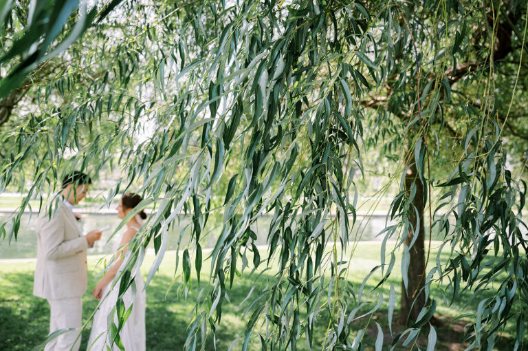 Leah and Kevin’s wedding was nothing short of enchanting—fitting for two fellow Harry Potter fans! From the emotional first look to their joyous celebration surrounded by family and friends, their special day was filled with love, laughter, and memorable moments.
Their day began early at The View at Lincoln Park, one of Jersey City’s newest and most unique wedding venues, part of the esteemed Landmark Venues collection. Nestled within the historic Lincoln Park, The View offers a modern yet timeless space with breathtaking scenery. The venue’s design is a stunning adaptive reuse of the original Lincoln Lodge (est. 1929), featuring preserved stone facades, timber beams, and antique fixtures. This blend of contemporary elegance and historic charm makes it a truly one-of-a-kind setting for weddings.
When I arrived, I was excited to explore the property and its surroundings. The View’s lush grounds, picturesque willow tree, and nearby landmarks, including the Lincoln Park Fountain, provide endless opportunities for stunning photographs. The morning was quiet as Leah and her bridesmaids arrived, carrying their dresses over their shoulders, and settled into the spacious bridal suite. Later, Kevin and their families arrived, and the anticipation began to build.
Leah and Kevin’s first look by the willow tree was a moment to remember. As the wind danced through the branches, tears filled Leah’s eyes as they read their vows to each other—an intimate, heartfelt exchange that perfectly set the tone for the day.
Guests began filling the chairs in Lincoln Room (the third-floor ceremony space), a modern area with large windows that allow natural light to flood in. This versatile room offers an elegant setting for ceremonies, with views of the surrounding park and cityscape. As Leah walked down the aisle with her father, they exchanged emotional glances, and the energy in the room was palpable.
The celebration moved to The Ballroom, The View’s stunning reception space. With its high ceilings, contemporary design, and floor-to-ceiling windows offering views of the park, the room was transformed into the perfect party atmosphere. Guests cheered as Leah and Kevin made their grand entrance, and their first dance kicked off an evening of fun, laughter, and memories.
Before the day concluded, Kevin had a special request for a photo by the Lincoln Park Fountain, a highlight of the park’s charm. We strolled over with Leah and Kevin to capture some magical portraits by the water. One of the great things about daytime weddings at The View is the ample natural light, ensuring we had beautiful lighting for photos even after the reception.
Leah and Kevin’s wedding was a joy to photograph, and The View at Lincoln Park provided the perfect backdrop for their unforgettable day. Congratulations to the happy couple—I’m so grateful to have been part of your story!
Leah and Kevin's The View at Lincoln Park Jersey City NJ documented by Karis from Hey Karis New York, Brooklyn, Hudson Valley NY and Catskills NY and NJ Wedding and NYC Elopement Photographer.
