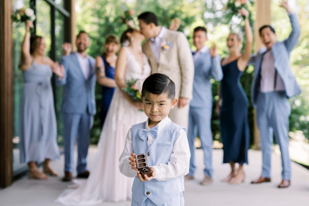 Leah and Kevin’s wedding was nothing short of enchanting—fitting for two fellow Harry Potter fans! From the emotional first look to their joyous celebration surrounded by family and friends, their special day was filled with love, laughter, and memorable moments.
Their day began early at The View at Lincoln Park, one of Jersey City’s newest and most unique wedding venues, part of the esteemed Landmark Venues collection. Nestled within the historic Lincoln Park, The View offers a modern yet timeless space with breathtaking scenery. The venue’s design is a stunning adaptive reuse of the original Lincoln Lodge (est. 1929), featuring preserved stone facades, timber beams, and antique fixtures. This blend of contemporary elegance and historic charm makes it a truly one-of-a-kind setting for weddings.
When I arrived, I was excited to explore the property and its surroundings. The View’s lush grounds, picturesque willow tree, and nearby landmarks, including the Lincoln Park Fountain, provide endless opportunities for stunning photographs. The morning was quiet as Leah and her bridesmaids arrived, carrying their dresses over their shoulders, and settled into the spacious bridal suite. Later, Kevin and their families arrived, and the anticipation began to build.
Leah and Kevin’s first look by the willow tree was a moment to remember. As the wind danced through the branches, tears filled Leah’s eyes as they read their vows to each other—an intimate, heartfelt exchange that perfectly set the tone for the day.
Guests began filling the chairs in Lincoln Room (the third-floor ceremony space), a modern area with large windows that allow natural light to flood in. This versatile room offers an elegant setting for ceremonies, with views of the surrounding park and cityscape. As Leah walked down the aisle with her father, they exchanged emotional glances, and the energy in the room was palpable.
The celebration moved to The Ballroom, The View’s stunning reception space. With its high ceilings, contemporary design, and floor-to-ceiling windows offering views of the park, the room was transformed into the perfect party atmosphere. Guests cheered as Leah and Kevin made their grand entrance, and their first dance kicked off an evening of fun, laughter, and memories.
Before the day concluded, Kevin had a special request for a photo by the Lincoln Park Fountain, a highlight of the park’s charm. We strolled over with Leah and Kevin to capture some magical portraits by the water. One of the great things about daytime weddings at The View is the ample natural light, ensuring we had beautiful lighting for photos even after the reception.
Leah and Kevin’s wedding was a joy to photograph, and The View at Lincoln Park provided the perfect backdrop for their unforgettable day. Congratulations to the happy couple—I’m so grateful to have been part of your story!
Leah and Kevin's The View at Lincoln Park Jersey City NJ documented by Karis from Hey Karis New York, Brooklyn, Hudson Valley NY and Catskills NY and NJ Wedding and NYC Elopement Photographer.
