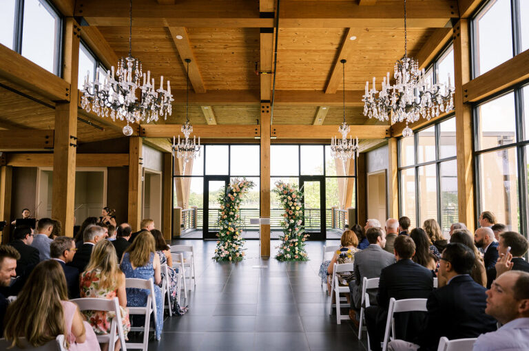 Leah and Kevin’s wedding was nothing short of enchanting—fitting for two fellow Harry Potter fans! From the emotional first look to their joyous celebration surrounded by family and friends, their special day was filled with love, laughter, and memorable moments.
Their day began early at The View at Lincoln Park, one of Jersey City’s newest and most unique wedding venues, part of the esteemed Landmark Venues collection. Nestled within the historic Lincoln Park, The View offers a modern yet timeless space with breathtaking scenery. The venue’s design is a stunning adaptive reuse of the original Lincoln Lodge (est. 1929), featuring preserved stone facades, timber beams, and antique fixtures. This blend of contemporary elegance and historic charm makes it a truly one-of-a-kind setting for weddings.
When I arrived, I was excited to explore the property and its surroundings. The View’s lush grounds, picturesque willow tree, and nearby landmarks, including the Lincoln Park Fountain, provide endless opportunities for stunning photographs. The morning was quiet as Leah and her bridesmaids arrived, carrying their dresses over their shoulders, and settled into the spacious bridal suite. Later, Kevin and their families arrived, and the anticipation began to build.
Leah and Kevin’s first look by the willow tree was a moment to remember. As the wind danced through the branches, tears filled Leah’s eyes as they read their vows to each other—an intimate, heartfelt exchange that perfectly set the tone for the day.
Guests began filling the chairs in Lincoln Room (the third-floor ceremony space), a modern area with large windows that allow natural light to flood in. This versatile room offers an elegant setting for ceremonies, with views of the surrounding park and cityscape. As Leah walked down the aisle with her father, they exchanged emotional glances, and the energy in the room was palpable.
The celebration moved to The Ballroom, The View’s stunning reception space. With its high ceilings, contemporary design, and floor-to-ceiling windows offering views of the park, the room was transformed into the perfect party atmosphere. Guests cheered as Leah and Kevin made their grand entrance, and their first dance kicked off an evening of fun, laughter, and memories.
Before the day concluded, Kevin had a special request for a photo by the Lincoln Park Fountain, a highlight of the park’s charm. We strolled over with Leah and Kevin to capture some magical portraits by the water. One of the great things about daytime weddings at The View is the ample natural light, ensuring we had beautiful lighting for photos even after the reception.
Leah and Kevin’s wedding was a joy to photograph, and The View at Lincoln Park provided the perfect backdrop for their unforgettable day. Congratulations to the happy couple—I’m so grateful to have been part of your story!
Leah and Kevin's The View at Lincoln Park Jersey City NJ documented by Karis from Hey Karis New York, Brooklyn, Hudson Valley NY and Catskills NY and NJ Wedding and NYC Elopement Photographer.
