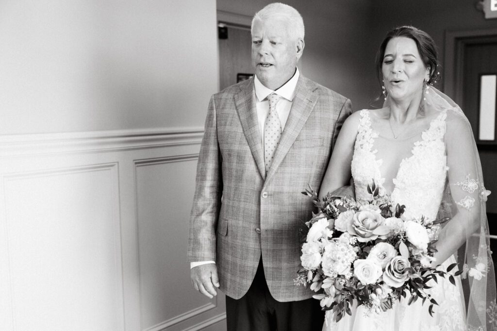 Leah and Kevin’s wedding was nothing short of enchanting—fitting for two fellow Harry Potter fans! From the emotional first look to their joyous celebration surrounded by family and friends, their special day was filled with love, laughter, and memorable moments.
Their day began early at The View at Lincoln Park, one of Jersey City’s newest and most unique wedding venues, part of the esteemed Landmark Venues collection. Nestled within the historic Lincoln Park, The View offers a modern yet timeless space with breathtaking scenery. The venue’s design is a stunning adaptive reuse of the original Lincoln Lodge (est. 1929), featuring preserved stone facades, timber beams, and antique fixtures. This blend of contemporary elegance and historic charm makes it a truly one-of-a-kind setting for weddings.
When I arrived, I was excited to explore the property and its surroundings. The View’s lush grounds, picturesque willow tree, and nearby landmarks, including the Lincoln Park Fountain, provide endless opportunities for stunning photographs. The morning was quiet as Leah and her bridesmaids arrived, carrying their dresses over their shoulders, and settled into the spacious bridal suite. Later, Kevin and their families arrived, and the anticipation began to build.
Leah and Kevin’s first look by the willow tree was a moment to remember. As the wind danced through the branches, tears filled Leah’s eyes as they read their vows to each other—an intimate, heartfelt exchange that perfectly set the tone for the day.
Guests began filling the chairs in Lincoln Room (the third-floor ceremony space), a modern area with large windows that allow natural light to flood in. This versatile room offers an elegant setting for ceremonies, with views of the surrounding park and cityscape. As Leah walked down the aisle with her father, they exchanged emotional glances, and the energy in the room was palpable.
The celebration moved to The Ballroom, The View’s stunning reception space. With its high ceilings, contemporary design, and floor-to-ceiling windows offering views of the park, the room was transformed into the perfect party atmosphere. Guests cheered as Leah and Kevin made their grand entrance, and their first dance kicked off an evening of fun, laughter, and memories.
Before the day concluded, Kevin had a special request for a photo by the Lincoln Park Fountain, a highlight of the park’s charm. We strolled over with Leah and Kevin to capture some magical portraits by the water. One of the great things about daytime weddings at The View is the ample natural light, ensuring we had beautiful lighting for photos even after the reception.
Leah and Kevin’s wedding was a joy to photograph, and The View at Lincoln Park provided the perfect backdrop for their unforgettable day. Congratulations to the happy couple—I’m so grateful to have been part of your story!
Leah and Kevin's The View at Lincoln Park Jersey City NJ documented by Karis from Hey Karis New York, Brooklyn, Hudson Valley NY and Catskills NY and NJ Wedding and NYC Elopement Photographer.
