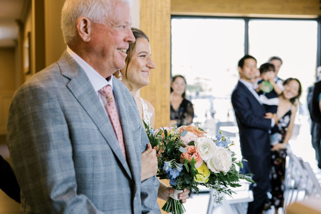 Leah and Kevin’s wedding was nothing short of enchanting—fitting for two fellow Harry Potter fans! From the emotional first look to their joyous celebration surrounded by family and friends, their special day was filled with love, laughter, and memorable moments.
Their day began early at The View at Lincoln Park, one of Jersey City’s newest and most unique wedding venues, part of the esteemed Landmark Venues collection. Nestled within the historic Lincoln Park, The View offers a modern yet timeless space with breathtaking scenery. The venue’s design is a stunning adaptive reuse of the original Lincoln Lodge (est. 1929), featuring preserved stone facades, timber beams, and antique fixtures. This blend of contemporary elegance and historic charm makes it a truly one-of-a-kind setting for weddings.
When I arrived, I was excited to explore the property and its surroundings. The View’s lush grounds, picturesque willow tree, and nearby landmarks, including the Lincoln Park Fountain, provide endless opportunities for stunning photographs. The morning was quiet as Leah and her bridesmaids arrived, carrying their dresses over their shoulders, and settled into the spacious bridal suite. Later, Kevin and their families arrived, and the anticipation began to build.
Leah and Kevin’s first look by the willow tree was a moment to remember. As the wind danced through the branches, tears filled Leah’s eyes as they read their vows to each other—an intimate, heartfelt exchange that perfectly set the tone for the day.
Guests began filling the chairs in Lincoln Room (the third-floor ceremony space), a modern area with large windows that allow natural light to flood in. This versatile room offers an elegant setting for ceremonies, with views of the surrounding park and cityscape. As Leah walked down the aisle with her father, they exchanged emotional glances, and the energy in the room was palpable.
The celebration moved to The Ballroom, The View’s stunning reception space. With its high ceilings, contemporary design, and floor-to-ceiling windows offering views of the park, the room was transformed into the perfect party atmosphere. Guests cheered as Leah and Kevin made their grand entrance, and their first dance kicked off an evening of fun, laughter, and memories.
Before the day concluded, Kevin had a special request for a photo by the Lincoln Park Fountain, a highlight of the park’s charm. We strolled over with Leah and Kevin to capture some magical portraits by the water. One of the great things about daytime weddings at The View is the ample natural light, ensuring we had beautiful lighting for photos even after the reception.
Leah and Kevin’s wedding was a joy to photograph, and The View at Lincoln Park provided the perfect backdrop for their unforgettable day. Congratulations to the happy couple—I’m so grateful to have been part of your story!
Leah and Kevin's The View at Lincoln Park Jersey City NJ documented by Karis from Hey Karis New York, Brooklyn, Hudson Valley NY and Catskills NY and NJ Wedding and NYC Elopement Photographer.
