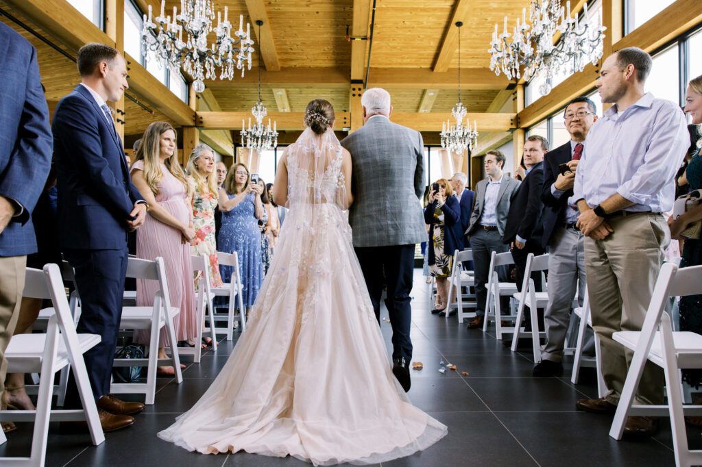 Leah and Kevin’s wedding was nothing short of enchanting—fitting for two fellow Harry Potter fans! From the emotional first look to their joyous celebration surrounded by family and friends, their special day was filled with love, laughter, and memorable moments.
Their day began early at The View at Lincoln Park, one of Jersey City’s newest and most unique wedding venues, part of the esteemed Landmark Venues collection. Nestled within the historic Lincoln Park, The View offers a modern yet timeless space with breathtaking scenery. The venue’s design is a stunning adaptive reuse of the original Lincoln Lodge (est. 1929), featuring preserved stone facades, timber beams, and antique fixtures. This blend of contemporary elegance and historic charm makes it a truly one-of-a-kind setting for weddings.
When I arrived, I was excited to explore the property and its surroundings. The View’s lush grounds, picturesque willow tree, and nearby landmarks, including the Lincoln Park Fountain, provide endless opportunities for stunning photographs. The morning was quiet as Leah and her bridesmaids arrived, carrying their dresses over their shoulders, and settled into the spacious bridal suite. Later, Kevin and their families arrived, and the anticipation began to build.
Leah and Kevin’s first look by the willow tree was a moment to remember. As the wind danced through the branches, tears filled Leah’s eyes as they read their vows to each other—an intimate, heartfelt exchange that perfectly set the tone for the day.
Guests began filling the chairs in Lincoln Room (the third-floor ceremony space), a modern area with large windows that allow natural light to flood in. This versatile room offers an elegant setting for ceremonies, with views of the surrounding park and cityscape. As Leah walked down the aisle with her father, they exchanged emotional glances, and the energy in the room was palpable.
The celebration moved to The Ballroom, The View’s stunning reception space. With its high ceilings, contemporary design, and floor-to-ceiling windows offering views of the park, the room was transformed into the perfect party atmosphere. Guests cheered as Leah and Kevin made their grand entrance, and their first dance kicked off an evening of fun, laughter, and memories.
Before the day concluded, Kevin had a special request for a photo by the Lincoln Park Fountain, a highlight of the park’s charm. We strolled over with Leah and Kevin to capture some magical portraits by the water. One of the great things about daytime weddings at The View is the ample natural light, ensuring we had beautiful lighting for photos even after the reception.
Leah and Kevin’s wedding was a joy to photograph, and The View at Lincoln Park provided the perfect backdrop for their unforgettable day. Congratulations to the happy couple—I’m so grateful to have been part of your story!
Leah and Kevin's The View at Lincoln Park Jersey City NJ documented by Karis from Hey Karis New York, Brooklyn, Hudson Valley NY and Catskills NY and NJ Wedding and NYC Elopement Photographer.
