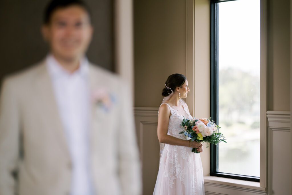 Leah and Kevin’s wedding was nothing short of enchanting—fitting for two fellow Harry Potter fans! From the emotional first look to their joyous celebration surrounded by family and friends, their special day was filled with love, laughter, and memorable moments.
Their day began early at The View at Lincoln Park, one of Jersey City’s newest and most unique wedding venues, part of the esteemed Landmark Venues collection. Nestled within the historic Lincoln Park, The View offers a modern yet timeless space with breathtaking scenery. The venue’s design is a stunning adaptive reuse of the original Lincoln Lodge (est. 1929), featuring preserved stone facades, timber beams, and antique fixtures. This blend of contemporary elegance and historic charm makes it a truly one-of-a-kind setting for weddings.
When I arrived, I was excited to explore the property and its surroundings. The View’s lush grounds, picturesque willow tree, and nearby landmarks, including the Lincoln Park Fountain, provide endless opportunities for stunning photographs. The morning was quiet as Leah and her bridesmaids arrived, carrying their dresses over their shoulders, and settled into the spacious bridal suite. Later, Kevin and their families arrived, and the anticipation began to build.
Leah and Kevin’s first look by the willow tree was a moment to remember. As the wind danced through the branches, tears filled Leah’s eyes as they read their vows to each other—an intimate, heartfelt exchange that perfectly set the tone for the day.
Guests began filling the chairs in Lincoln Room (the third-floor ceremony space), a modern area with large windows that allow natural light to flood in. This versatile room offers an elegant setting for ceremonies, with views of the surrounding park and cityscape. As Leah walked down the aisle with her father, they exchanged emotional glances, and the energy in the room was palpable.
The celebration moved to The Ballroom, The View’s stunning reception space. With its high ceilings, contemporary design, and floor-to-ceiling windows offering views of the park, the room was transformed into the perfect party atmosphere. Guests cheered as Leah and Kevin made their grand entrance, and their first dance kicked off an evening of fun, laughter, and memories.
Before the day concluded, Kevin had a special request for a photo by the Lincoln Park Fountain, a highlight of the park’s charm. We strolled over with Leah and Kevin to capture some magical portraits by the water. One of the great things about daytime weddings at The View is the ample natural light, ensuring we had beautiful lighting for photos even after the reception.
Leah and Kevin’s wedding was a joy to photograph, and The View at Lincoln Park provided the perfect backdrop for their unforgettable day. Congratulations to the happy couple—I’m so grateful to have been part of your story!
Leah and Kevin's The View at Lincoln Park Jersey City NJ documented by Karis from Hey Karis New York, Brooklyn, Hudson Valley NY and Catskills NY and NJ Wedding and NYC Elopement Photographer.
