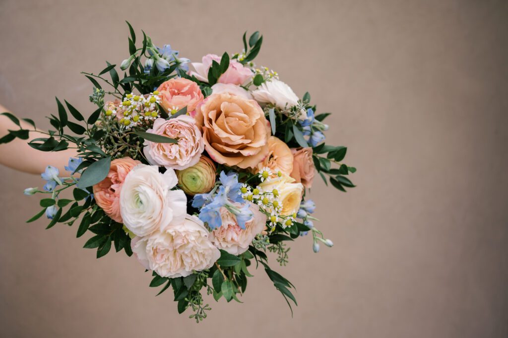 Leah and Kevin’s wedding was nothing short of enchanting—fitting for two fellow Harry Potter fans! From the emotional first look to their joyous celebration surrounded by family and friends, their special day was filled with love, laughter, and memorable moments.
Their day began early at The View at Lincoln Park, one of Jersey City’s newest and most unique wedding venues, part of the esteemed Landmark Venues collection. Nestled within the historic Lincoln Park, The View offers a modern yet timeless space with breathtaking scenery. The venue’s design is a stunning adaptive reuse of the original Lincoln Lodge (est. 1929), featuring preserved stone facades, timber beams, and antique fixtures. This blend of contemporary elegance and historic charm makes it a truly one-of-a-kind setting for weddings.
When I arrived, I was excited to explore the property and its surroundings. The View’s lush grounds, picturesque willow tree, and nearby landmarks, including the Lincoln Park Fountain, provide endless opportunities for stunning photographs. The morning was quiet as Leah and her bridesmaids arrived, carrying their dresses over their shoulders, and settled into the spacious bridal suite. Later, Kevin and their families arrived, and the anticipation began to build.
Leah and Kevin’s first look by the willow tree was a moment to remember. As the wind danced through the branches, tears filled Leah’s eyes as they read their vows to each other—an intimate, heartfelt exchange that perfectly set the tone for the day.
Guests began filling the chairs in Lincoln Room (the third-floor ceremony space), a modern area with large windows that allow natural light to flood in. This versatile room offers an elegant setting for ceremonies, with views of the surrounding park and cityscape. As Leah walked down the aisle with her father, they exchanged emotional glances, and the energy in the room was palpable.
The celebration moved to The Ballroom, The View’s stunning reception space. With its high ceilings, contemporary design, and floor-to-ceiling windows offering views of the park, the room was transformed into the perfect party atmosphere. Guests cheered as Leah and Kevin made their grand entrance, and their first dance kicked off an evening of fun, laughter, and memories.
Before the day concluded, Kevin had a special request for a photo by the Lincoln Park Fountain, a highlight of the park’s charm. We strolled over with Leah and Kevin to capture some magical portraits by the water. One of the great things about daytime weddings at The View is the ample natural light, ensuring we had beautiful lighting for photos even after the reception.
Leah and Kevin’s wedding was a joy to photograph, and The View at Lincoln Park provided the perfect backdrop for their unforgettable day. Congratulations to the happy couple—I’m so grateful to have been part of your story!
Leah and Kevin's The View at Lincoln Park Jersey City NJ documented by Karis from Hey Karis New York, Brooklyn, Hudson Valley NY and Catskills NY and NJ Wedding and NYC Elopement Photographer.
