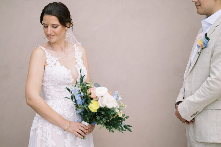 Leah and Kevin’s wedding was nothing short of enchanting—fitting for two fellow Harry Potter fans! From the emotional first look to their joyous celebration surrounded by family and friends, their special day was filled with love, laughter, and memorable moments.
Their day began early at The View at Lincoln Park, one of Jersey City’s newest and most unique wedding venues, part of the esteemed Landmark Venues collection. Nestled within the historic Lincoln Park, The View offers a modern yet timeless space with breathtaking scenery. The venue’s design is a stunning adaptive reuse of the original Lincoln Lodge (est. 1929), featuring preserved stone facades, timber beams, and antique fixtures. This blend of contemporary elegance and historic charm makes it a truly one-of-a-kind setting for weddings.
When I arrived, I was excited to explore the property and its surroundings. The View’s lush grounds, picturesque willow tree, and nearby landmarks, including the Lincoln Park Fountain, provide endless opportunities for stunning photographs. The morning was quiet as Leah and her bridesmaids arrived, carrying their dresses over their shoulders, and settled into the spacious bridal suite. Later, Kevin and their families arrived, and the anticipation began to build.
Leah and Kevin’s first look by the willow tree was a moment to remember. As the wind danced through the branches, tears filled Leah’s eyes as they read their vows to each other—an intimate, heartfelt exchange that perfectly set the tone for the day.
Guests began filling the chairs in Lincoln Room (the third-floor ceremony space), a modern area with large windows that allow natural light to flood in. This versatile room offers an elegant setting for ceremonies, with views of the surrounding park and cityscape. As Leah walked down the aisle with her father, they exchanged emotional glances, and the energy in the room was palpable.
The celebration moved to The Ballroom, The View’s stunning reception space. With its high ceilings, contemporary design, and floor-to-ceiling windows offering views of the park, the room was transformed into the perfect party atmosphere. Guests cheered as Leah and Kevin made their grand entrance, and their first dance kicked off an evening of fun, laughter, and memories.
Before the day concluded, Kevin had a special request for a photo by the Lincoln Park Fountain, a highlight of the park’s charm. We strolled over with Leah and Kevin to capture some magical portraits by the water. One of the great things about daytime weddings at The View is the ample natural light, ensuring we had beautiful lighting for photos even after the reception.
Leah and Kevin’s wedding was a joy to photograph, and The View at Lincoln Park provided the perfect backdrop for their unforgettable day. Congratulations to the happy couple—I’m so grateful to have been part of your story!
Leah and Kevin's The View at Lincoln Park Jersey City NJ documented by Karis from Hey Karis New York, Brooklyn, Hudson Valley NY and Catskills NY and NJ Wedding and NYC Elopement Photographer.
