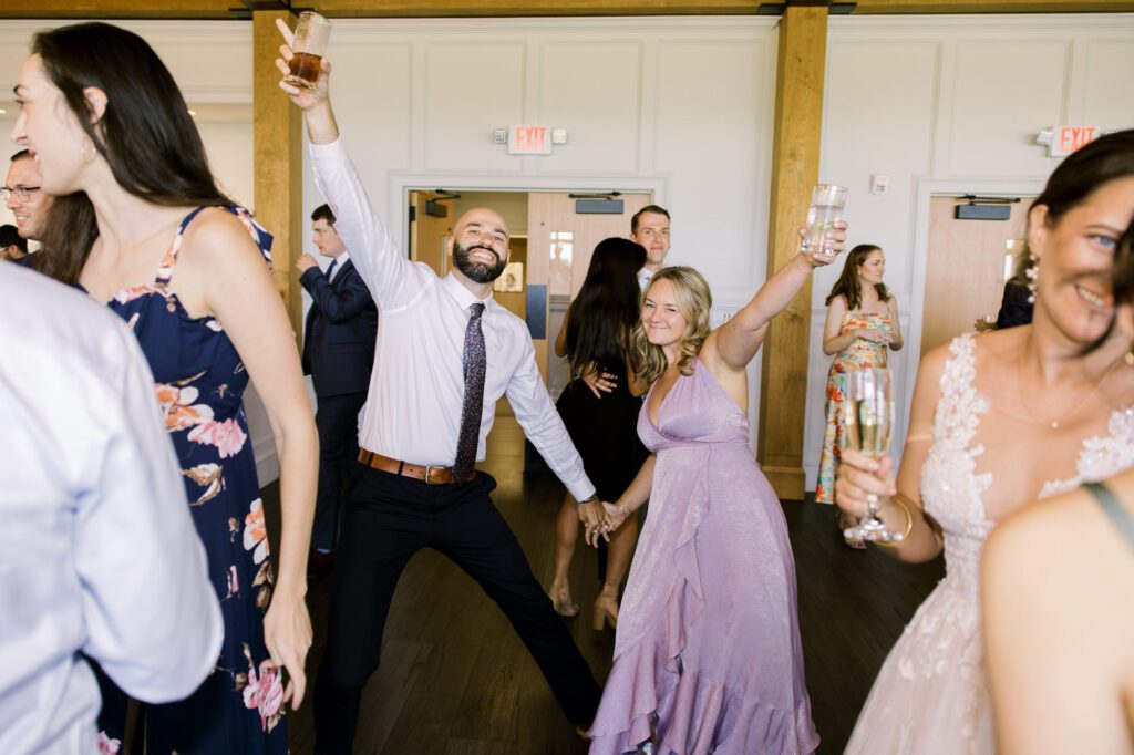 Leah and Kevin’s wedding was nothing short of enchanting—fitting for two fellow Harry Potter fans! From the emotional first look to their joyous celebration surrounded by family and friends, their special day was filled with love, laughter, and memorable moments.
Their day began early at The View at Lincoln Park, one of Jersey City’s newest and most unique wedding venues, part of the esteemed Landmark Venues collection. Nestled within the historic Lincoln Park, The View offers a modern yet timeless space with breathtaking scenery. The venue’s design is a stunning adaptive reuse of the original Lincoln Lodge (est. 1929), featuring preserved stone facades, timber beams, and antique fixtures. This blend of contemporary elegance and historic charm makes it a truly one-of-a-kind setting for weddings.
When I arrived, I was excited to explore the property and its surroundings. The View’s lush grounds, picturesque willow tree, and nearby landmarks, including the Lincoln Park Fountain, provide endless opportunities for stunning photographs. The morning was quiet as Leah and her bridesmaids arrived, carrying their dresses over their shoulders, and settled into the spacious bridal suite. Later, Kevin and their families arrived, and the anticipation began to build.
Leah and Kevin’s first look by the willow tree was a moment to remember. As the wind danced through the branches, tears filled Leah’s eyes as they read their vows to each other—an intimate, heartfelt exchange that perfectly set the tone for the day.
Guests began filling the chairs in Lincoln Room (the third-floor ceremony space), a modern area with large windows that allow natural light to flood in. This versatile room offers an elegant setting for ceremonies, with views of the surrounding park and cityscape. As Leah walked down the aisle with her father, they exchanged emotional glances, and the energy in the room was palpable.
The celebration moved to The Ballroom, The View’s stunning reception space. With its high ceilings, contemporary design, and floor-to-ceiling windows offering views of the park, the room was transformed into the perfect party atmosphere. Guests cheered as Leah and Kevin made their grand entrance, and their first dance kicked off an evening of fun, laughter, and memories.
Before the day concluded, Kevin had a special request for a photo by the Lincoln Park Fountain, a highlight of the park’s charm. We strolled over with Leah and Kevin to capture some magical portraits by the water. One of the great things about daytime weddings at The View is the ample natural light, ensuring we had beautiful lighting for photos even after the reception.
Leah and Kevin’s wedding was a joy to photograph, and The View at Lincoln Park provided the perfect backdrop for their unforgettable day. Congratulations to the happy couple—I’m so grateful to have been part of your story!
Leah and Kevin's The View at Lincoln Park Jersey City NJ documented by Karis from Hey Karis New York, Brooklyn, Hudson Valley NY and Catskills NY and NJ Wedding and NYC Elopement Photographer.
