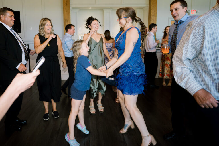 Leah and Kevin’s wedding was nothing short of enchanting—fitting for two fellow Harry Potter fans! From the emotional first look to their joyous celebration surrounded by family and friends, their special day was filled with love, laughter, and memorable moments.
Their day began early at The View at Lincoln Park, one of Jersey City’s newest and most unique wedding venues, part of the esteemed Landmark Venues collection. Nestled within the historic Lincoln Park, The View offers a modern yet timeless space with breathtaking scenery. The venue’s design is a stunning adaptive reuse of the original Lincoln Lodge (est. 1929), featuring preserved stone facades, timber beams, and antique fixtures. This blend of contemporary elegance and historic charm makes it a truly one-of-a-kind setting for weddings.
When I arrived, I was excited to explore the property and its surroundings. The View’s lush grounds, picturesque willow tree, and nearby landmarks, including the Lincoln Park Fountain, provide endless opportunities for stunning photographs. The morning was quiet as Leah and her bridesmaids arrived, carrying their dresses over their shoulders, and settled into the spacious bridal suite. Later, Kevin and their families arrived, and the anticipation began to build.
Leah and Kevin’s first look by the willow tree was a moment to remember. As the wind danced through the branches, tears filled Leah’s eyes as they read their vows to each other—an intimate, heartfelt exchange that perfectly set the tone for the day.
Guests began filling the chairs in Lincoln Room (the third-floor ceremony space), a modern area with large windows that allow natural light to flood in. This versatile room offers an elegant setting for ceremonies, with views of the surrounding park and cityscape. As Leah walked down the aisle with her father, they exchanged emotional glances, and the energy in the room was palpable.
The celebration moved to The Ballroom, The View’s stunning reception space. With its high ceilings, contemporary design, and floor-to-ceiling windows offering views of the park, the room was transformed into the perfect party atmosphere. Guests cheered as Leah and Kevin made their grand entrance, and their first dance kicked off an evening of fun, laughter, and memories.
Before the day concluded, Kevin had a special request for a photo by the Lincoln Park Fountain, a highlight of the park’s charm. We strolled over with Leah and Kevin to capture some magical portraits by the water. One of the great things about daytime weddings at The View is the ample natural light, ensuring we had beautiful lighting for photos even after the reception.
Leah and Kevin’s wedding was a joy to photograph, and The View at Lincoln Park provided the perfect backdrop for their unforgettable day. Congratulations to the happy couple—I’m so grateful to have been part of your story!
Leah and Kevin's The View at Lincoln Park Jersey City NJ documented by Karis from Hey Karis New York, Brooklyn, Hudson Valley NY and Catskills NY and NJ Wedding and NYC Elopement Photographer.
