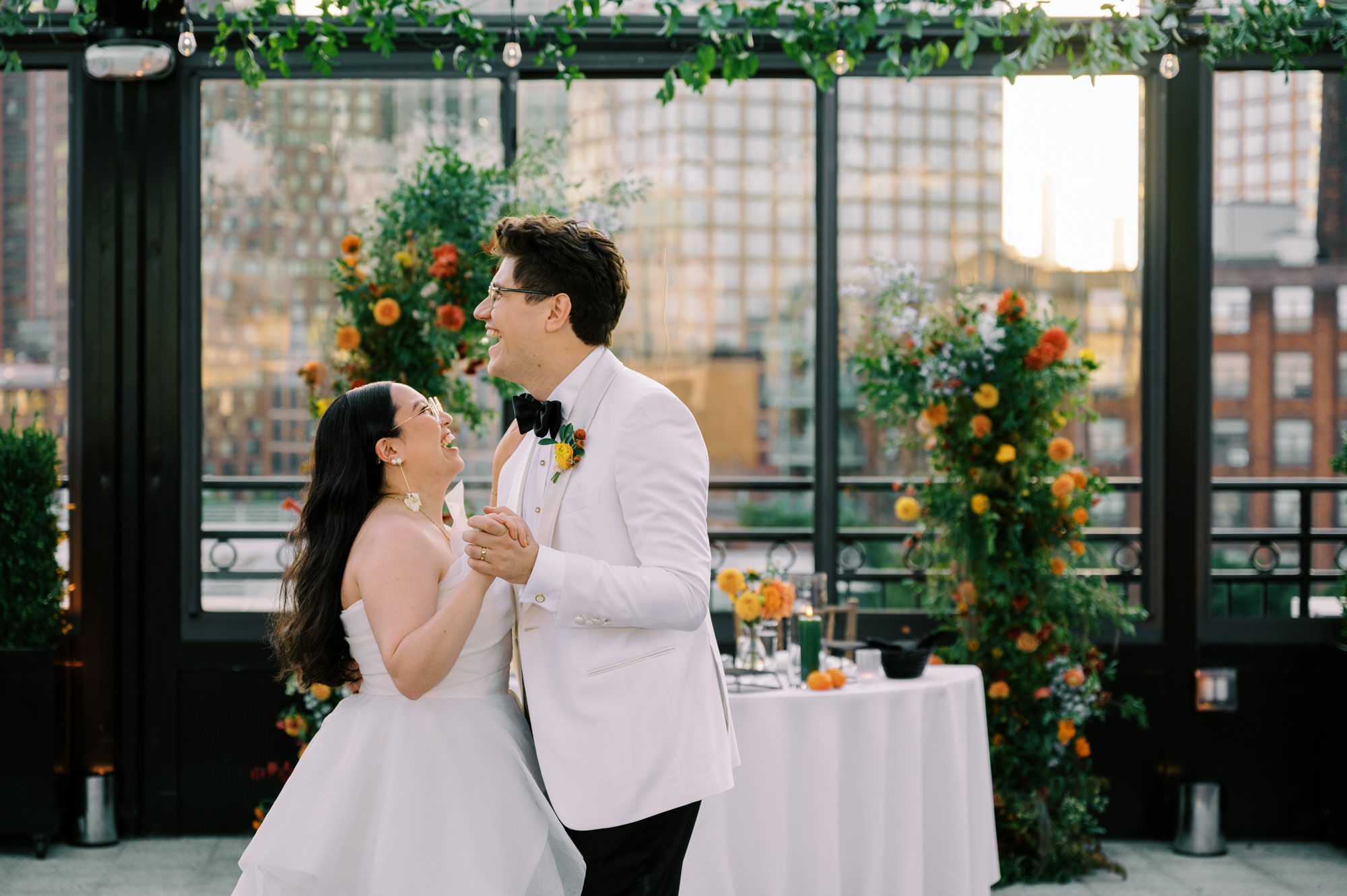 So excited for Erika and Andrei’s wedding day at The Box House Hotel in Brooklyn, NY. This boutique hotel had been on my bucket list for a while, and it did not disappoint! With its unique design, vibrant personality, and incredible rooftop views, The Box House Hotel provided the perfect setting for unique wedding celebration.
The day began with Erika and Andrei getting ready in their respective rooms, surrounded by friends and loved ones. One of the standout features of The Box House Hotel is its boutique charm and eclectic style, blending industrial elements with a cozy, artistic vibe. Erika’s bridal suite, with its floor-to-ceiling windows, was filled with natural light, making it a dream space for capturing those intimate getting-ready moments.
Once everyone was ready, Andrei headed to the rooftop, eagerly waiting to see his bride for the first time. As Erika gracefully approached, her dress swaying in the breeze, Andrei turned around, completely captivated. The two shared a private, heartfelt moment, whispering sweet words to each other, before we moved on to family photos.
The Box House Hotel’s location on a quiet Brooklyn street was perfect for photos. We captured their formal family and bridal party shots right in front of the hotel, showcasing its charming exterior. Then came a unique tradition I’d never witnessed before in my 14+ years of wedding photography! Erika and Andrei brought out a bucket of water filled with coins, and as guests cheered, Erika kicked the bucket as far as she could—a cultural ritual symbolizing good luck and prosperity. It was a joy to photograph and such a fun, memorable moment!
Afterward, we made our way back to the 10,000-square-foot rooftop, which offers unparalleled panoramic views of Manhattan, Brooklyn, and Long Island City. It’s a breathtaking setting for any wedding, leaving guests in awe of the skyline. Friends and family traveled from near and far, including Japan and Romania, to celebrate Erika and Andrei. To honor Erika's Japanese roots, Erika and Andrei incorporated a Japanese tea ceremony officiated by Erika's cousins from Japan. The rooftop was filled with laughter, love, and joy as the ceremony unfolded under the open sky.
As the sun set, the magic of the evening truly came alive. The city skyline twinkled with lights, and the dark sky sparkled with stars. Erika and Andrei danced, laughed, and celebrated late into the night, surrounded by their closest friends and family.
The Box House Hotel is a one-of-a-kind venue, blending urban sophistication with artistic charm. Its rooftop views, boutique-style accommodations, and vibrant atmosphere make it a perfect choice for couples looking to create a unique and unforgettable wedding experience.
Erika and Andrei, thank you for letting me be part of your incredible day. Wishing you a lifetime of love, happiness, and adventure!
Erika and Andrei The Box House Hotel Brooklyn NY Wedding documented by Karis from Hey Karis New York, Brooklyn, Hudson Valley NY and Catskills NY and NJ Wedding and NYC Elopement Photographer.