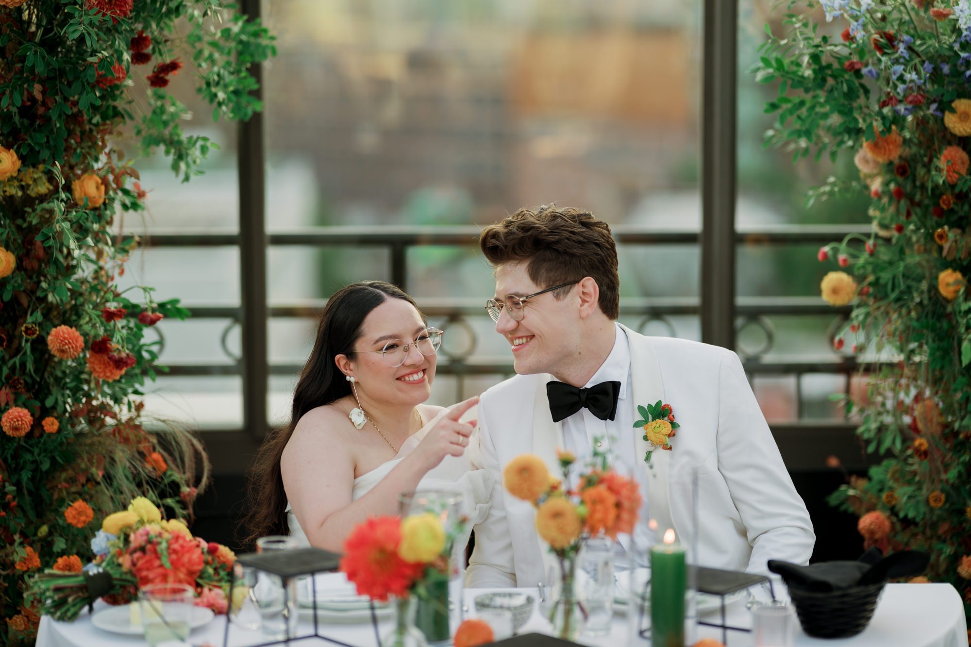 So excited for Erika and Andrei’s wedding day at The Box House Hotel in Brooklyn, NY. This boutique hotel had been on my bucket list for a while, and it did not disappoint! With its unique design, vibrant personality, and incredible rooftop views, The Box House Hotel provided the perfect setting for unique wedding celebration.
The day began with Erika and Andrei getting ready in their respective rooms, surrounded by friends and loved ones. One of the standout features of The Box House Hotel is its boutique charm and eclectic style, blending industrial elements with a cozy, artistic vibe. Erika’s bridal suite, with its floor-to-ceiling windows, was filled with natural light, making it a dream space for capturing those intimate getting-ready moments.
Once everyone was ready, Andrei headed to the rooftop, eagerly waiting to see his bride for the first time. As Erika gracefully approached, her dress swaying in the breeze, Andrei turned around, completely captivated. The two shared a private, heartfelt moment, whispering sweet words to each other, before we moved on to family photos.
The Box House Hotel’s location on a quiet Brooklyn street was perfect for photos. We captured their formal family and bridal party shots right in front of the hotel, showcasing its charming exterior. Then came a unique tradition I’d never witnessed before in my 14+ years of wedding photography! Erika and Andrei brought out a bucket of water filled with coins, and as guests cheered, Erika kicked the bucket as far as she could—a cultural ritual symbolizing good luck and prosperity. It was a joy to photograph and such a fun, memorable moment!
Afterward, we made our way back to the 10,000-square-foot rooftop, which offers unparalleled panoramic views of Manhattan, Brooklyn, and Long Island City. It’s a breathtaking setting for any wedding, leaving guests in awe of the skyline. Friends and family traveled from near and far, including Japan and Romania, to celebrate Erika and Andrei. To honor Erika's Japanese roots, Erika and Andrei incorporated a Japanese tea ceremony officiated by Erika's cousins from Japan. The rooftop was filled with laughter, love, and joy as the ceremony unfolded under the open sky.
As the sun set, the magic of the evening truly came alive. The city skyline twinkled with lights, and the dark sky sparkled with stars. Erika and Andrei danced, laughed, and celebrated late into the night, surrounded by their closest friends and family.
The Box House Hotel is a one-of-a-kind venue, blending urban sophistication with artistic charm. Its rooftop views, boutique-style accommodations, and vibrant atmosphere make it a perfect choice for couples looking to create a unique and unforgettable wedding experience.
Erika and Andrei, thank you for letting me be part of your incredible day. Wishing you a lifetime of love, happiness, and adventure!
Erika and Andrei The Box House Hotel Brooklyn NY Wedding documented by Karis from Hey Karis New York, Brooklyn, Hudson Valley NY and Catskills NY and NJ Wedding and NYC Elopement Photographer.