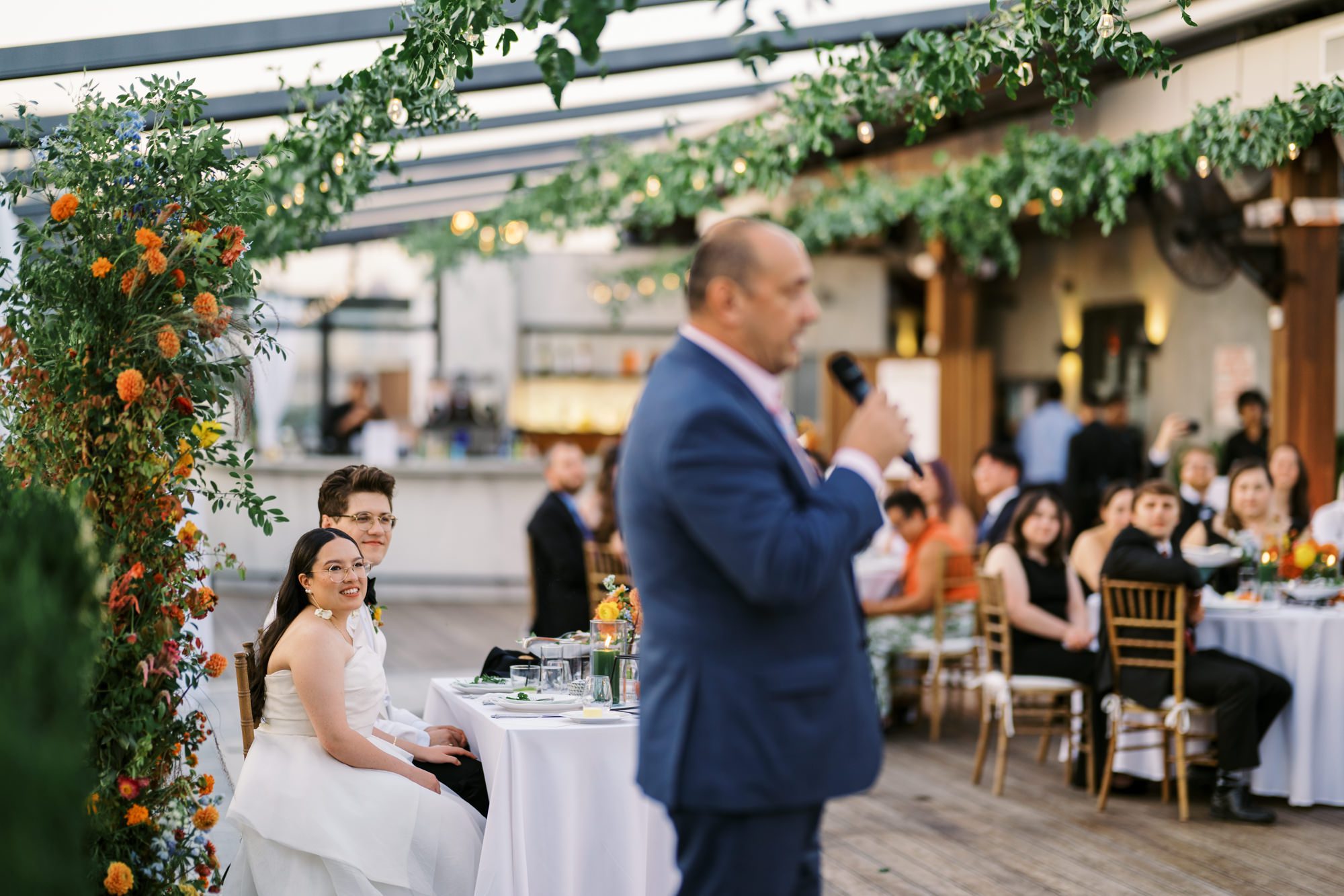 So excited for Erika and Andrei’s wedding day at The Box House Hotel in Brooklyn, NY. This boutique hotel had been on my bucket list for a while, and it did not disappoint! With its unique design, vibrant personality, and incredible rooftop views, The Box House Hotel provided the perfect setting for unique wedding celebration.
The day began with Erika and Andrei getting ready in their respective rooms, surrounded by friends and loved ones. One of the standout features of The Box House Hotel is its boutique charm and eclectic style, blending industrial elements with a cozy, artistic vibe. Erika’s bridal suite, with its floor-to-ceiling windows, was filled with natural light, making it a dream space for capturing those intimate getting-ready moments.
Once everyone was ready, Andrei headed to the rooftop, eagerly waiting to see his bride for the first time. As Erika gracefully approached, her dress swaying in the breeze, Andrei turned around, completely captivated. The two shared a private, heartfelt moment, whispering sweet words to each other, before we moved on to family photos.
The Box House Hotel’s location on a quiet Brooklyn street was perfect for photos. We captured their formal family and bridal party shots right in front of the hotel, showcasing its charming exterior. Then came a unique tradition I’d never witnessed before in my 14+ years of wedding photography! Erika and Andrei brought out a bucket of water filled with coins, and as guests cheered, Erika kicked the bucket as far as she could—a cultural ritual symbolizing good luck and prosperity. It was a joy to photograph and such a fun, memorable moment!
Afterward, we made our way back to the 10,000-square-foot rooftop, which offers unparalleled panoramic views of Manhattan, Brooklyn, and Long Island City. It’s a breathtaking setting for any wedding, leaving guests in awe of the skyline. Friends and family traveled from near and far, including Japan and Romania, to celebrate Erika and Andrei. To honor Erika's Japanese roots, Erika and Andrei incorporated a Japanese tea ceremony officiated by Erika's cousins from Japan. The rooftop was filled with laughter, love, and joy as the ceremony unfolded under the open sky.
As the sun set, the magic of the evening truly came alive. The city skyline twinkled with lights, and the dark sky sparkled with stars. Erika and Andrei danced, laughed, and celebrated late into the night, surrounded by their closest friends and family.
The Box House Hotel is a one-of-a-kind venue, blending urban sophistication with artistic charm. Its rooftop views, boutique-style accommodations, and vibrant atmosphere make it a perfect choice for couples looking to create a unique and unforgettable wedding experience.
Erika and Andrei, thank you for letting me be part of your incredible day. Wishing you a lifetime of love, happiness, and adventure!
Erika and Andrei The Box House Hotel Brooklyn NY Wedding documented by Karis from Hey Karis New York, Brooklyn, Hudson Valley NY and Catskills NY and NJ Wedding and NYC Elopement Photographer.