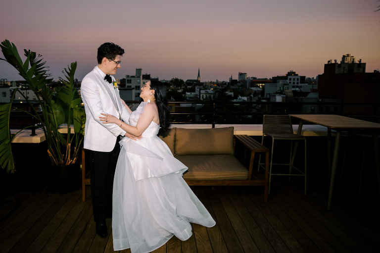 So excited for Erika and Andrei’s wedding day at The Box House Hotel in Brooklyn, NY. This boutique hotel had been on my bucket list for a while, and it did not disappoint! With its unique design, vibrant personality, and incredible rooftop views, The Box House Hotel provided the perfect setting for unique wedding celebration.
The day began with Erika and Andrei getting ready in their respective rooms, surrounded by friends and loved ones. One of the standout features of The Box House Hotel is its boutique charm and eclectic style, blending industrial elements with a cozy, artistic vibe. Erika’s bridal suite, with its floor-to-ceiling windows, was filled with natural light, making it a dream space for capturing those intimate getting-ready moments.
Once everyone was ready, Andrei headed to the rooftop, eagerly waiting to see his bride for the first time. As Erika gracefully approached, her dress swaying in the breeze, Andrei turned around, completely captivated. The two shared a private, heartfelt moment, whispering sweet words to each other, before we moved on to family photos.
The Box House Hotel’s location on a quiet Brooklyn street was perfect for photos. We captured their formal family and bridal party shots right in front of the hotel, showcasing its charming exterior. Then came a unique tradition I’d never witnessed before in my 14+ years of wedding photography! Erika and Andrei brought out a bucket of water filled with coins, and as guests cheered, Erika kicked the bucket as far as she could—a cultural ritual symbolizing good luck and prosperity. It was a joy to photograph and such a fun, memorable moment!
Afterward, we made our way back to the 10,000-square-foot rooftop, which offers unparalleled panoramic views of Manhattan, Brooklyn, and Long Island City. It’s a breathtaking setting for any wedding, leaving guests in awe of the skyline. Friends and family traveled from near and far, including Japan and Romania, to celebrate Erika and Andrei. To honor Erika's Japanese roots, Erika and Andrei incorporated a Japanese tea ceremony officiated by Erika's cousins from Japan. The rooftop was filled with laughter, love, and joy as the ceremony unfolded under the open sky.
As the sun set, the magic of the evening truly came alive. The city skyline twinkled with lights, and the dark sky sparkled with stars. Erika and Andrei danced, laughed, and celebrated late into the night, surrounded by their closest friends and family.
The Box House Hotel is a one-of-a-kind venue, blending urban sophistication with artistic charm. Its rooftop views, boutique-style accommodations, and vibrant atmosphere make it a perfect choice for couples looking to create a unique and unforgettable wedding experience.
Erika and Andrei, thank you for letting me be part of your incredible day. Wishing you a lifetime of love, happiness, and adventure!
Erika and Andrei The Box House Hotel Brooklyn NY Wedding documented by Karis from Hey Karis New York, Brooklyn, Hudson Valley NY and Catskills NY and NJ Wedding and NYC Elopement Photographer.