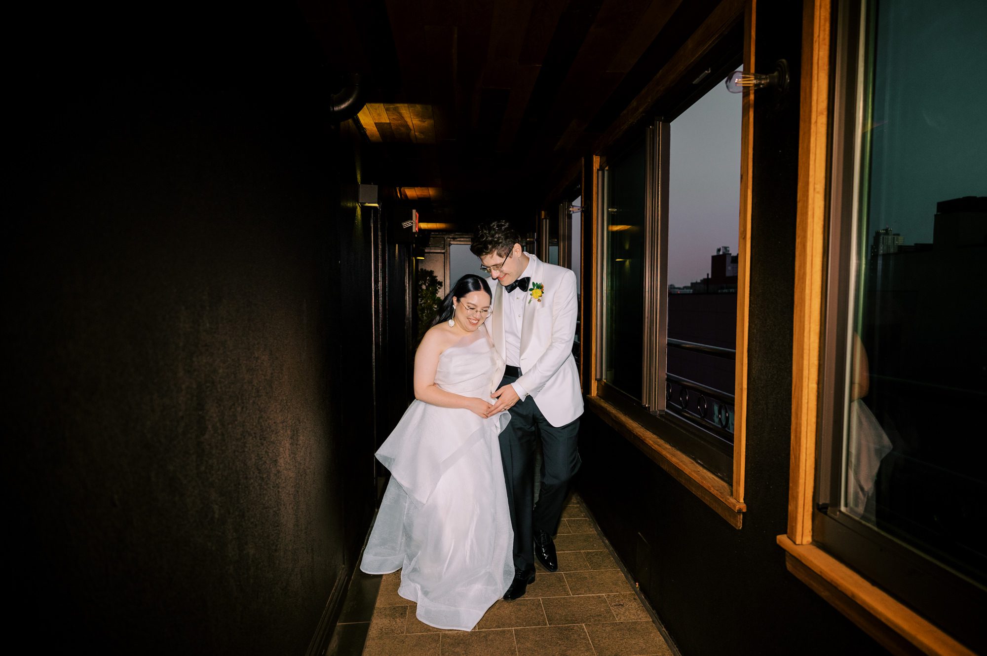 So excited for Erika and Andrei’s wedding day at The Box House Hotel in Brooklyn, NY. This boutique hotel had been on my bucket list for a while, and it did not disappoint! With its unique design, vibrant personality, and incredible rooftop views, The Box House Hotel provided the perfect setting for unique wedding celebration.
The day began with Erika and Andrei getting ready in their respective rooms, surrounded by friends and loved ones. One of the standout features of The Box House Hotel is its boutique charm and eclectic style, blending industrial elements with a cozy, artistic vibe. Erika’s bridal suite, with its floor-to-ceiling windows, was filled with natural light, making it a dream space for capturing those intimate getting-ready moments.
Once everyone was ready, Andrei headed to the rooftop, eagerly waiting to see his bride for the first time. As Erika gracefully approached, her dress swaying in the breeze, Andrei turned around, completely captivated. The two shared a private, heartfelt moment, whispering sweet words to each other, before we moved on to family photos.
The Box House Hotel’s location on a quiet Brooklyn street was perfect for photos. We captured their formal family and bridal party shots right in front of the hotel, showcasing its charming exterior. Then came a unique tradition I’d never witnessed before in my 14+ years of wedding photography! Erika and Andrei brought out a bucket of water filled with coins, and as guests cheered, Erika kicked the bucket as far as she could—a cultural ritual symbolizing good luck and prosperity. It was a joy to photograph and such a fun, memorable moment!
Afterward, we made our way back to the 10,000-square-foot rooftop, which offers unparalleled panoramic views of Manhattan, Brooklyn, and Long Island City. It’s a breathtaking setting for any wedding, leaving guests in awe of the skyline. Friends and family traveled from near and far, including Japan and Romania, to celebrate Erika and Andrei. To honor Erika's Japanese roots, Erika and Andrei incorporated a Japanese tea ceremony officiated by Erika's cousins from Japan. The rooftop was filled with laughter, love, and joy as the ceremony unfolded under the open sky.
As the sun set, the magic of the evening truly came alive. The city skyline twinkled with lights, and the dark sky sparkled with stars. Erika and Andrei danced, laughed, and celebrated late into the night, surrounded by their closest friends and family.
The Box House Hotel is a one-of-a-kind venue, blending urban sophistication with artistic charm. Its rooftop views, boutique-style accommodations, and vibrant atmosphere make it a perfect choice for couples looking to create a unique and unforgettable wedding experience.
Erika and Andrei, thank you for letting me be part of your incredible day. Wishing you a lifetime of love, happiness, and adventure!
Erika and Andrei The Box House Hotel Brooklyn NY Wedding documented by Karis from Hey Karis New York, Brooklyn, Hudson Valley NY and Catskills NY and NJ Wedding and NYC Elopement Photographer.