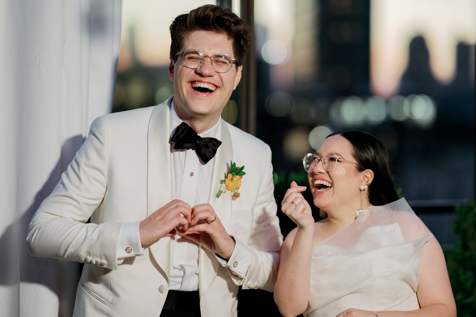 So excited for Erika and Andrei’s wedding day at The Box House Hotel in Brooklyn, NY. This boutique hotel had been on my bucket list for a while, and it did not disappoint! With its unique design, vibrant personality, and incredible rooftop views, The Box House Hotel provided the perfect setting for unique wedding celebration.
The day began with Erika and Andrei getting ready in their respective rooms, surrounded by friends and loved ones. One of the standout features of The Box House Hotel is its boutique charm and eclectic style, blending industrial elements with a cozy, artistic vibe. Erika’s bridal suite, with its floor-to-ceiling windows, was filled with natural light, making it a dream space for capturing those intimate getting-ready moments.
Once everyone was ready, Andrei headed to the rooftop, eagerly waiting to see his bride for the first time. As Erika gracefully approached, her dress swaying in the breeze, Andrei turned around, completely captivated. The two shared a private, heartfelt moment, whispering sweet words to each other, before we moved on to family photos.
The Box House Hotel’s location on a quiet Brooklyn street was perfect for photos. We captured their formal family and bridal party shots right in front of the hotel, showcasing its charming exterior. Then came a unique tradition I’d never witnessed before in my 14+ years of wedding photography! Erika and Andrei brought out a bucket of water filled with coins, and as guests cheered, Erika kicked the bucket as far as she could—a cultural ritual symbolizing good luck and prosperity. It was a joy to photograph and such a fun, memorable moment!
Afterward, we made our way back to the 10,000-square-foot rooftop, which offers unparalleled panoramic views of Manhattan, Brooklyn, and Long Island City. It’s a breathtaking setting for any wedding, leaving guests in awe of the skyline. Friends and family traveled from near and far, including Japan and Romania, to celebrate Erika and Andrei. To honor Erika's Japanese roots, Erika and Andrei incorporated a Japanese tea ceremony officiated by Erika's cousins from Japan. The rooftop was filled with laughter, love, and joy as the ceremony unfolded under the open sky.
As the sun set, the magic of the evening truly came alive. The city skyline twinkled with lights, and the dark sky sparkled with stars. Erika and Andrei danced, laughed, and celebrated late into the night, surrounded by their closest friends and family.
The Box House Hotel is a one-of-a-kind venue, blending urban sophistication with artistic charm. Its rooftop views, boutique-style accommodations, and vibrant atmosphere make it a perfect choice for couples looking to create a unique and unforgettable wedding experience.
Erika and Andrei, thank you for letting me be part of your incredible day. Wishing you a lifetime of love, happiness, and adventure!
Erika and Andrei The Box House Hotel Brooklyn NY Wedding documented by Karis from Hey Karis New York, Brooklyn, Hudson Valley NY and Catskills NY and NJ Wedding and NYC Elopement Photographer.