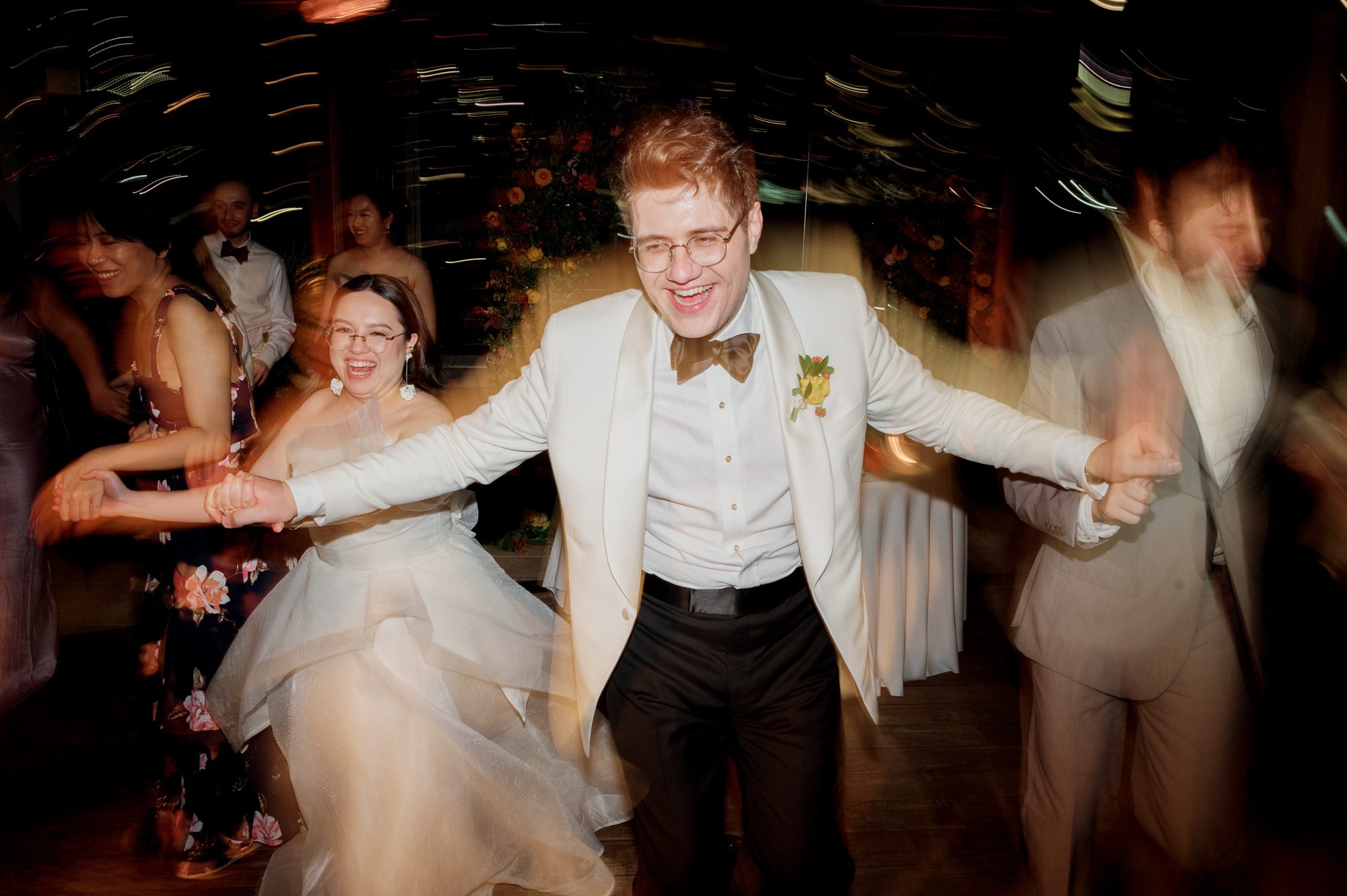 So excited for Erika and Andrei’s wedding day at The Box House Hotel in Brooklyn, NY. This boutique hotel had been on my bucket list for a while, and it did not disappoint! With its unique design, vibrant personality, and incredible rooftop views, The Box House Hotel provided the perfect setting for unique wedding celebration.
The day began with Erika and Andrei getting ready in their respective rooms, surrounded by friends and loved ones. One of the standout features of The Box House Hotel is its boutique charm and eclectic style, blending industrial elements with a cozy, artistic vibe. Erika’s bridal suite, with its floor-to-ceiling windows, was filled with natural light, making it a dream space for capturing those intimate getting-ready moments.
Once everyone was ready, Andrei headed to the rooftop, eagerly waiting to see his bride for the first time. As Erika gracefully approached, her dress swaying in the breeze, Andrei turned around, completely captivated. The two shared a private, heartfelt moment, whispering sweet words to each other, before we moved on to family photos.
The Box House Hotel’s location on a quiet Brooklyn street was perfect for photos. We captured their formal family and bridal party shots right in front of the hotel, showcasing its charming exterior. Then came a unique tradition I’d never witnessed before in my 14+ years of wedding photography! Erika and Andrei brought out a bucket of water filled with coins, and as guests cheered, Erika kicked the bucket as far as she could—a cultural ritual symbolizing good luck and prosperity. It was a joy to photograph and such a fun, memorable moment!
Afterward, we made our way back to the 10,000-square-foot rooftop, which offers unparalleled panoramic views of Manhattan, Brooklyn, and Long Island City. It’s a breathtaking setting for any wedding, leaving guests in awe of the skyline. Friends and family traveled from near and far, including Japan and Romania, to celebrate Erika and Andrei. To honor Erika's Japanese roots, Erika and Andrei incorporated a Japanese tea ceremony officiated by Erika's cousins from Japan. The rooftop was filled with laughter, love, and joy as the ceremony unfolded under the open sky.
As the sun set, the magic of the evening truly came alive. The city skyline twinkled with lights, and the dark sky sparkled with stars. Erika and Andrei danced, laughed, and celebrated late into the night, surrounded by their closest friends and family.
The Box House Hotel is a one-of-a-kind venue, blending urban sophistication with artistic charm. Its rooftop views, boutique-style accommodations, and vibrant atmosphere make it a perfect choice for couples looking to create a unique and unforgettable wedding experience.
Erika and Andrei, thank you for letting me be part of your incredible day. Wishing you a lifetime of love, happiness, and adventure!
Erika and Andrei The Box House Hotel Brooklyn NY Wedding documented by Karis from Hey Karis New York, Brooklyn, Hudson Valley NY and Catskills NY and NJ Wedding and NYC Elopement Photographer.