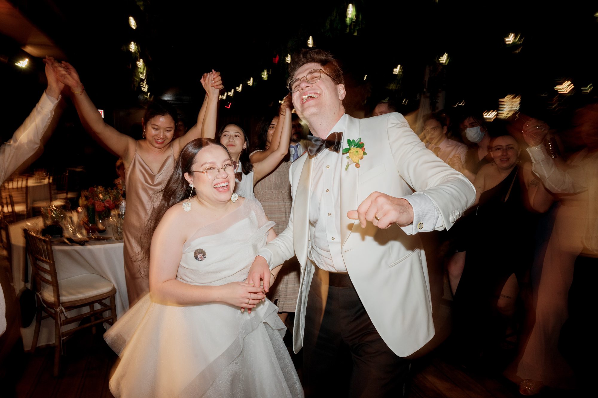 So excited for Erika and Andrei’s wedding day at The Box House Hotel in Brooklyn, NY. This boutique hotel had been on my bucket list for a while, and it did not disappoint! With its unique design, vibrant personality, and incredible rooftop views, The Box House Hotel provided the perfect setting for unique wedding celebration.
The day began with Erika and Andrei getting ready in their respective rooms, surrounded by friends and loved ones. One of the standout features of The Box House Hotel is its boutique charm and eclectic style, blending industrial elements with a cozy, artistic vibe. Erika’s bridal suite, with its floor-to-ceiling windows, was filled with natural light, making it a dream space for capturing those intimate getting-ready moments.
Once everyone was ready, Andrei headed to the rooftop, eagerly waiting to see his bride for the first time. As Erika gracefully approached, her dress swaying in the breeze, Andrei turned around, completely captivated. The two shared a private, heartfelt moment, whispering sweet words to each other, before we moved on to family photos.
The Box House Hotel’s location on a quiet Brooklyn street was perfect for photos. We captured their formal family and bridal party shots right in front of the hotel, showcasing its charming exterior. Then came a unique tradition I’d never witnessed before in my 14+ years of wedding photography! Erika and Andrei brought out a bucket of water filled with coins, and as guests cheered, Erika kicked the bucket as far as she could—a cultural ritual symbolizing good luck and prosperity. It was a joy to photograph and such a fun, memorable moment!
Afterward, we made our way back to the 10,000-square-foot rooftop, which offers unparalleled panoramic views of Manhattan, Brooklyn, and Long Island City. It’s a breathtaking setting for any wedding, leaving guests in awe of the skyline. Friends and family traveled from near and far, including Japan and Romania, to celebrate Erika and Andrei. To honor Erika's Japanese roots, Erika and Andrei incorporated a Japanese tea ceremony officiated by Erika's cousins from Japan. The rooftop was filled with laughter, love, and joy as the ceremony unfolded under the open sky.
As the sun set, the magic of the evening truly came alive. The city skyline twinkled with lights, and the dark sky sparkled with stars. Erika and Andrei danced, laughed, and celebrated late into the night, surrounded by their closest friends and family.
The Box House Hotel is a one-of-a-kind venue, blending urban sophistication with artistic charm. Its rooftop views, boutique-style accommodations, and vibrant atmosphere make it a perfect choice for couples looking to create a unique and unforgettable wedding experience.
Erika and Andrei, thank you for letting me be part of your incredible day. Wishing you a lifetime of love, happiness, and adventure!
Erika and Andrei The Box House Hotel Brooklyn NY Wedding documented by Karis from Hey Karis New York, Brooklyn, Hudson Valley NY and Catskills NY and NJ Wedding and NYC Elopement Photographer.