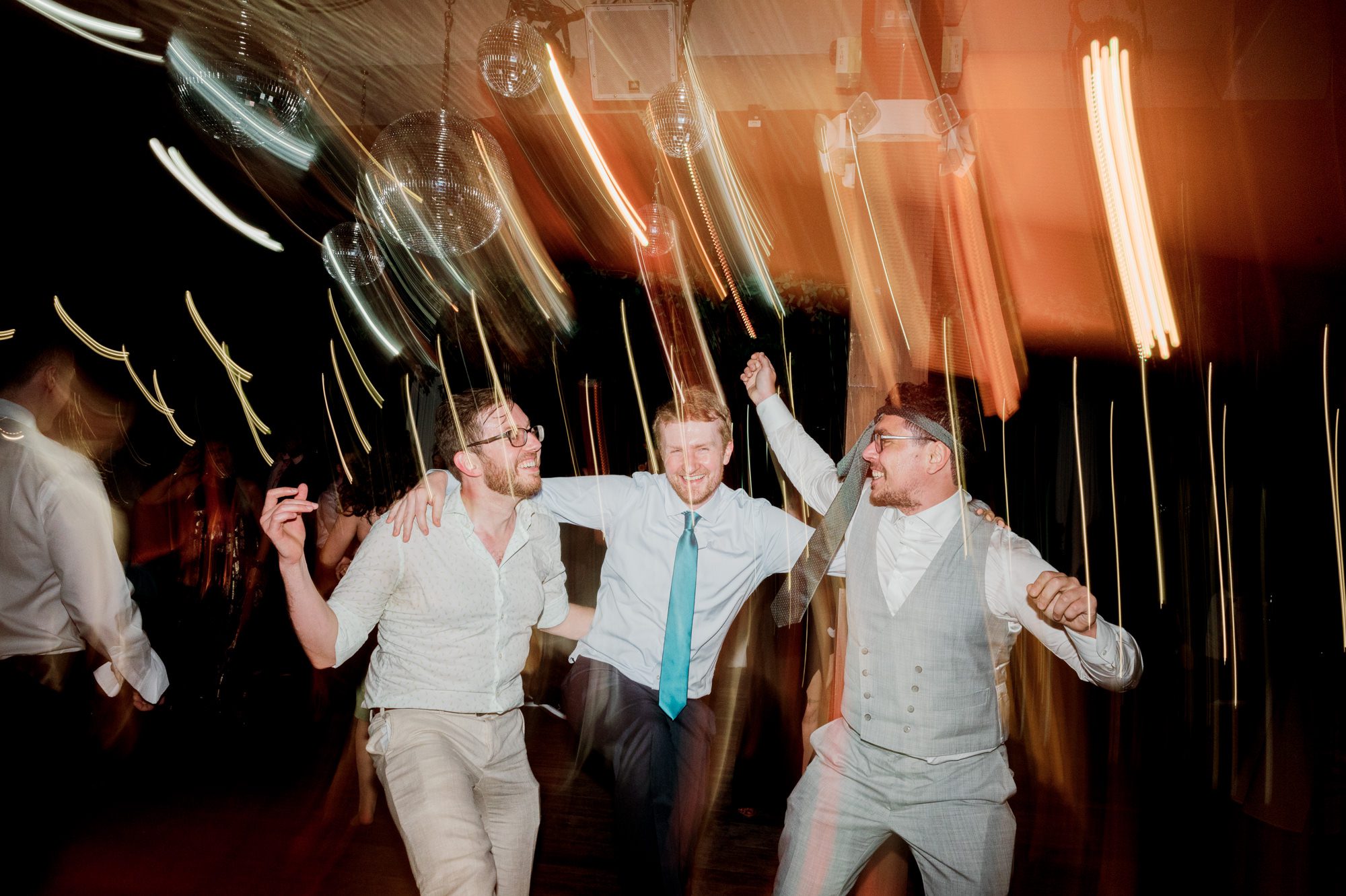 So excited for Erika and Andrei’s wedding day at The Box House Hotel in Brooklyn, NY. This boutique hotel had been on my bucket list for a while, and it did not disappoint! With its unique design, vibrant personality, and incredible rooftop views, The Box House Hotel provided the perfect setting for unique wedding celebration.
The day began with Erika and Andrei getting ready in their respective rooms, surrounded by friends and loved ones. One of the standout features of The Box House Hotel is its boutique charm and eclectic style, blending industrial elements with a cozy, artistic vibe. Erika’s bridal suite, with its floor-to-ceiling windows, was filled with natural light, making it a dream space for capturing those intimate getting-ready moments.
Once everyone was ready, Andrei headed to the rooftop, eagerly waiting to see his bride for the first time. As Erika gracefully approached, her dress swaying in the breeze, Andrei turned around, completely captivated. The two shared a private, heartfelt moment, whispering sweet words to each other, before we moved on to family photos.
The Box House Hotel’s location on a quiet Brooklyn street was perfect for photos. We captured their formal family and bridal party shots right in front of the hotel, showcasing its charming exterior. Then came a unique tradition I’d never witnessed before in my 14+ years of wedding photography! Erika and Andrei brought out a bucket of water filled with coins, and as guests cheered, Erika kicked the bucket as far as she could—a cultural ritual symbolizing good luck and prosperity. It was a joy to photograph and such a fun, memorable moment!
Afterward, we made our way back to the 10,000-square-foot rooftop, which offers unparalleled panoramic views of Manhattan, Brooklyn, and Long Island City. It’s a breathtaking setting for any wedding, leaving guests in awe of the skyline. Friends and family traveled from near and far, including Japan and Romania, to celebrate Erika and Andrei. To honor Erika's Japanese roots, Erika and Andrei incorporated a Japanese tea ceremony officiated by Erika's cousins from Japan. The rooftop was filled with laughter, love, and joy as the ceremony unfolded under the open sky.
As the sun set, the magic of the evening truly came alive. The city skyline twinkled with lights, and the dark sky sparkled with stars. Erika and Andrei danced, laughed, and celebrated late into the night, surrounded by their closest friends and family.
The Box House Hotel is a one-of-a-kind venue, blending urban sophistication with artistic charm. Its rooftop views, boutique-style accommodations, and vibrant atmosphere make it a perfect choice for couples looking to create a unique and unforgettable wedding experience.
Erika and Andrei, thank you for letting me be part of your incredible day. Wishing you a lifetime of love, happiness, and adventure!
Erika and Andrei The Box House Hotel Brooklyn NY Wedding documented by Karis from Hey Karis New York, Brooklyn, Hudson Valley NY and Catskills NY and NJ Wedding and NYC Elopement Photographer.