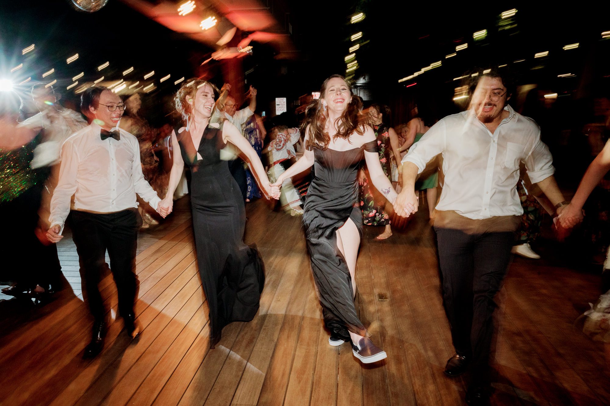 So excited for Erika and Andrei’s wedding day at The Box House Hotel in Brooklyn, NY. This boutique hotel had been on my bucket list for a while, and it did not disappoint! With its unique design, vibrant personality, and incredible rooftop views, The Box House Hotel provided the perfect setting for unique wedding celebration.
The day began with Erika and Andrei getting ready in their respective rooms, surrounded by friends and loved ones. One of the standout features of The Box House Hotel is its boutique charm and eclectic style, blending industrial elements with a cozy, artistic vibe. Erika’s bridal suite, with its floor-to-ceiling windows, was filled with natural light, making it a dream space for capturing those intimate getting-ready moments.
Once everyone was ready, Andrei headed to the rooftop, eagerly waiting to see his bride for the first time. As Erika gracefully approached, her dress swaying in the breeze, Andrei turned around, completely captivated. The two shared a private, heartfelt moment, whispering sweet words to each other, before we moved on to family photos.
The Box House Hotel’s location on a quiet Brooklyn street was perfect for photos. We captured their formal family and bridal party shots right in front of the hotel, showcasing its charming exterior. Then came a unique tradition I’d never witnessed before in my 14+ years of wedding photography! Erika and Andrei brought out a bucket of water filled with coins, and as guests cheered, Erika kicked the bucket as far as she could—a cultural ritual symbolizing good luck and prosperity. It was a joy to photograph and such a fun, memorable moment!
Afterward, we made our way back to the 10,000-square-foot rooftop, which offers unparalleled panoramic views of Manhattan, Brooklyn, and Long Island City. It’s a breathtaking setting for any wedding, leaving guests in awe of the skyline. Friends and family traveled from near and far, including Japan and Romania, to celebrate Erika and Andrei. To honor Erika's Japanese roots, Erika and Andrei incorporated a Japanese tea ceremony officiated by Erika's cousins from Japan. The rooftop was filled with laughter, love, and joy as the ceremony unfolded under the open sky.
As the sun set, the magic of the evening truly came alive. The city skyline twinkled with lights, and the dark sky sparkled with stars. Erika and Andrei danced, laughed, and celebrated late into the night, surrounded by their closest friends and family.
The Box House Hotel is a one-of-a-kind venue, blending urban sophistication with artistic charm. Its rooftop views, boutique-style accommodations, and vibrant atmosphere make it a perfect choice for couples looking to create a unique and unforgettable wedding experience.
Erika and Andrei, thank you for letting me be part of your incredible day. Wishing you a lifetime of love, happiness, and adventure!
Erika and Andrei The Box House Hotel Brooklyn NY Wedding documented by Karis from Hey Karis New York, Brooklyn, Hudson Valley NY and Catskills NY and NJ Wedding and NYC Elopement Photographer.