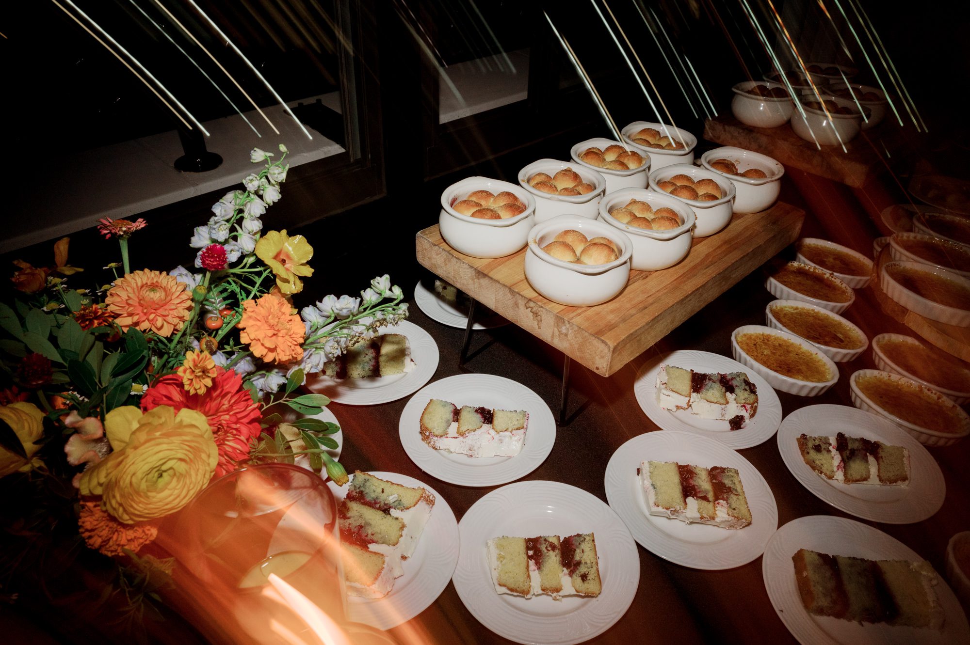 So excited for Erika and Andrei’s wedding day at The Box House Hotel in Brooklyn, NY. This boutique hotel had been on my bucket list for a while, and it did not disappoint! With its unique design, vibrant personality, and incredible rooftop views, The Box House Hotel provided the perfect setting for unique wedding celebration.
The day began with Erika and Andrei getting ready in their respective rooms, surrounded by friends and loved ones. One of the standout features of The Box House Hotel is its boutique charm and eclectic style, blending industrial elements with a cozy, artistic vibe. Erika’s bridal suite, with its floor-to-ceiling windows, was filled with natural light, making it a dream space for capturing those intimate getting-ready moments.
Once everyone was ready, Andrei headed to the rooftop, eagerly waiting to see his bride for the first time. As Erika gracefully approached, her dress swaying in the breeze, Andrei turned around, completely captivated. The two shared a private, heartfelt moment, whispering sweet words to each other, before we moved on to family photos.
The Box House Hotel’s location on a quiet Brooklyn street was perfect for photos. We captured their formal family and bridal party shots right in front of the hotel, showcasing its charming exterior. Then came a unique tradition I’d never witnessed before in my 14+ years of wedding photography! Erika and Andrei brought out a bucket of water filled with coins, and as guests cheered, Erika kicked the bucket as far as she could—a cultural ritual symbolizing good luck and prosperity. It was a joy to photograph and such a fun, memorable moment!
Afterward, we made our way back to the 10,000-square-foot rooftop, which offers unparalleled panoramic views of Manhattan, Brooklyn, and Long Island City. It’s a breathtaking setting for any wedding, leaving guests in awe of the skyline. Friends and family traveled from near and far, including Japan and Romania, to celebrate Erika and Andrei. To honor Erika's Japanese roots, Erika and Andrei incorporated a Japanese tea ceremony officiated by Erika's cousins from Japan. The rooftop was filled with laughter, love, and joy as the ceremony unfolded under the open sky.
As the sun set, the magic of the evening truly came alive. The city skyline twinkled with lights, and the dark sky sparkled with stars. Erika and Andrei danced, laughed, and celebrated late into the night, surrounded by their closest friends and family.
The Box House Hotel is a one-of-a-kind venue, blending urban sophistication with artistic charm. Its rooftop views, boutique-style accommodations, and vibrant atmosphere make it a perfect choice for couples looking to create a unique and unforgettable wedding experience.
Erika and Andrei, thank you for letting me be part of your incredible day. Wishing you a lifetime of love, happiness, and adventure!
Erika and Andrei The Box House Hotel Brooklyn NY Wedding documented by Karis from Hey Karis New York, Brooklyn, Hudson Valley NY and Catskills NY and NJ Wedding and NYC Elopement Photographer.