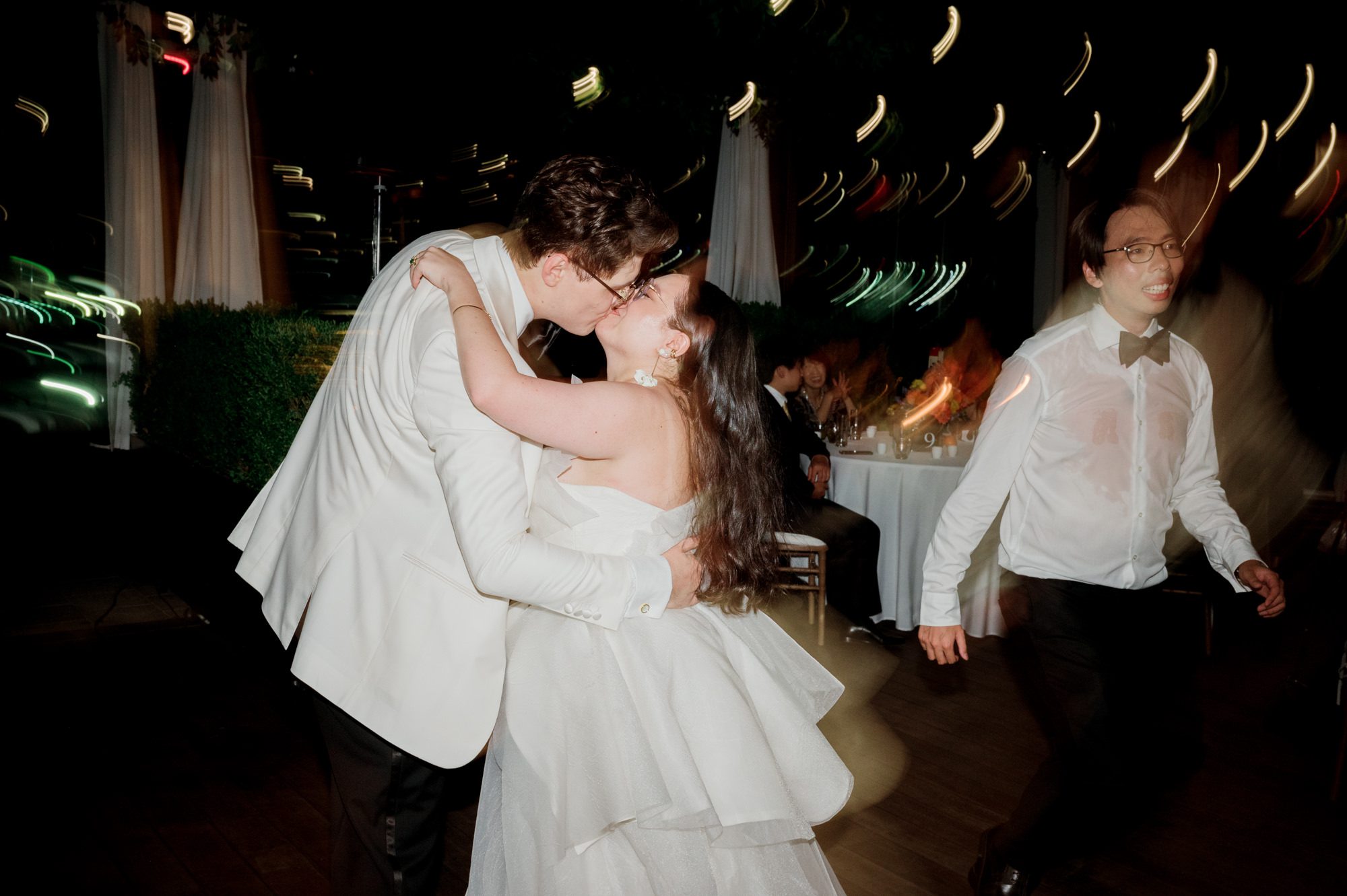 So excited for Erika and Andrei’s wedding day at The Box House Hotel in Brooklyn, NY. This boutique hotel had been on my bucket list for a while, and it did not disappoint! With its unique design, vibrant personality, and incredible rooftop views, The Box House Hotel provided the perfect setting for unique wedding celebration.
The day began with Erika and Andrei getting ready in their respective rooms, surrounded by friends and loved ones. One of the standout features of The Box House Hotel is its boutique charm and eclectic style, blending industrial elements with a cozy, artistic vibe. Erika’s bridal suite, with its floor-to-ceiling windows, was filled with natural light, making it a dream space for capturing those intimate getting-ready moments.
Once everyone was ready, Andrei headed to the rooftop, eagerly waiting to see his bride for the first time. As Erika gracefully approached, her dress swaying in the breeze, Andrei turned around, completely captivated. The two shared a private, heartfelt moment, whispering sweet words to each other, before we moved on to family photos.
The Box House Hotel’s location on a quiet Brooklyn street was perfect for photos. We captured their formal family and bridal party shots right in front of the hotel, showcasing its charming exterior. Then came a unique tradition I’d never witnessed before in my 14+ years of wedding photography! Erika and Andrei brought out a bucket of water filled with coins, and as guests cheered, Erika kicked the bucket as far as she could—a cultural ritual symbolizing good luck and prosperity. It was a joy to photograph and such a fun, memorable moment!
Afterward, we made our way back to the 10,000-square-foot rooftop, which offers unparalleled panoramic views of Manhattan, Brooklyn, and Long Island City. It’s a breathtaking setting for any wedding, leaving guests in awe of the skyline. Friends and family traveled from near and far, including Japan and Romania, to celebrate Erika and Andrei. To honor Erika's Japanese roots, Erika and Andrei incorporated a Japanese tea ceremony officiated by Erika's cousins from Japan. The rooftop was filled with laughter, love, and joy as the ceremony unfolded under the open sky.
As the sun set, the magic of the evening truly came alive. The city skyline twinkled with lights, and the dark sky sparkled with stars. Erika and Andrei danced, laughed, and celebrated late into the night, surrounded by their closest friends and family.
The Box House Hotel is a one-of-a-kind venue, blending urban sophistication with artistic charm. Its rooftop views, boutique-style accommodations, and vibrant atmosphere make it a perfect choice for couples looking to create a unique and unforgettable wedding experience.
Erika and Andrei, thank you for letting me be part of your incredible day. Wishing you a lifetime of love, happiness, and adventure!
Erika and Andrei The Box House Hotel Brooklyn NY Wedding documented by Karis from Hey Karis New York, Brooklyn, Hudson Valley NY and Catskills NY and NJ Wedding and NYC Elopement Photographer.