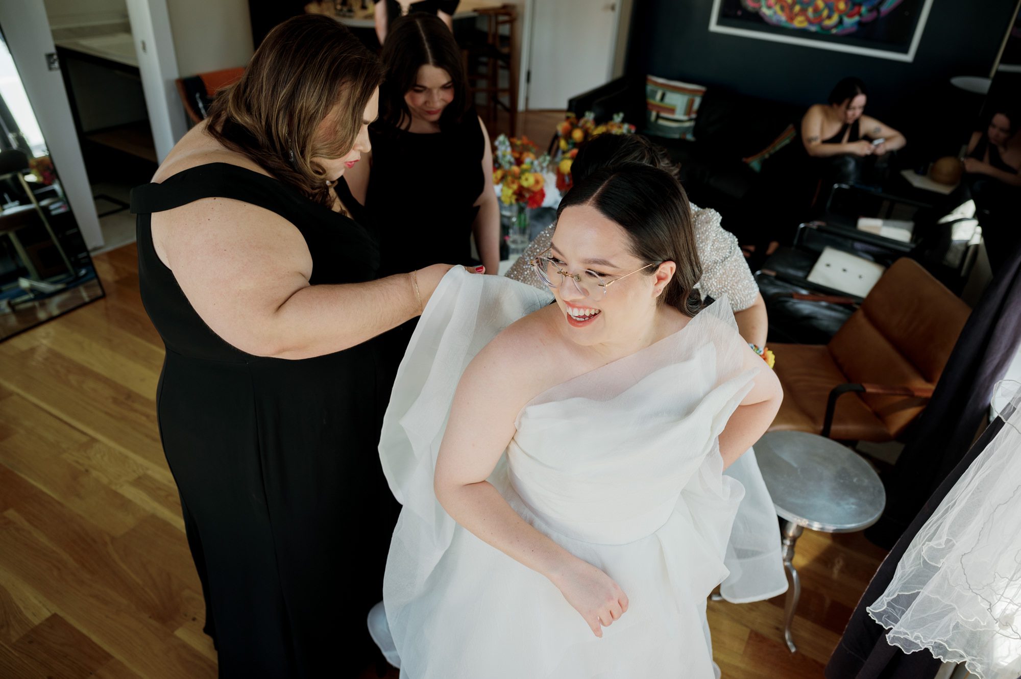 So excited for Erika and Andrei’s wedding day at The Box House Hotel in Brooklyn, NY. This boutique hotel had been on my bucket list for a while, and it did not disappoint! With its unique design, vibrant personality, and incredible rooftop views, The Box House Hotel provided the perfect setting for unique wedding celebration.
The day began with Erika and Andrei getting ready in their respective rooms, surrounded by friends and loved ones. One of the standout features of The Box House Hotel is its boutique charm and eclectic style, blending industrial elements with a cozy, artistic vibe. Erika’s bridal suite, with its floor-to-ceiling windows, was filled with natural light, making it a dream space for capturing those intimate getting-ready moments.
Once everyone was ready, Andrei headed to the rooftop, eagerly waiting to see his bride for the first time. As Erika gracefully approached, her dress swaying in the breeze, Andrei turned around, completely captivated. The two shared a private, heartfelt moment, whispering sweet words to each other, before we moved on to family photos.
The Box House Hotel’s location on a quiet Brooklyn street was perfect for photos. We captured their formal family and bridal party shots right in front of the hotel, showcasing its charming exterior. Then came a unique tradition I’d never witnessed before in my 14+ years of wedding photography! Erika and Andrei brought out a bucket of water filled with coins, and as guests cheered, Erika kicked the bucket as far as she could—a cultural ritual symbolizing good luck and prosperity. It was a joy to photograph and such a fun, memorable moment!
Afterward, we made our way back to the 10,000-square-foot rooftop, which offers unparalleled panoramic views of Manhattan, Brooklyn, and Long Island City. It’s a breathtaking setting for any wedding, leaving guests in awe of the skyline. Friends and family traveled from near and far, including Japan and Romania, to celebrate Erika and Andrei. To honor Erika's Japanese roots, Erika and Andrei incorporated a Japanese tea ceremony officiated by Erika's cousins from Japan. The rooftop was filled with laughter, love, and joy as the ceremony unfolded under the open sky.
As the sun set, the magic of the evening truly came alive. The city skyline twinkled with lights, and the dark sky sparkled with stars. Erika and Andrei danced, laughed, and celebrated late into the night, surrounded by their closest friends and family.
The Box House Hotel is a one-of-a-kind venue, blending urban sophistication with artistic charm. Its rooftop views, boutique-style accommodations, and vibrant atmosphere make it a perfect choice for couples looking to create a unique and unforgettable wedding experience.
Erika and Andrei, thank you for letting me be part of your incredible day. Wishing you a lifetime of love, happiness, and adventure!
Erika and Andrei The Box House Hotel Brooklyn NY Wedding documented by Karis from Hey Karis New York, Brooklyn, Hudson Valley NY and Catskills NY and NJ Wedding and NYC Elopement Photographer.