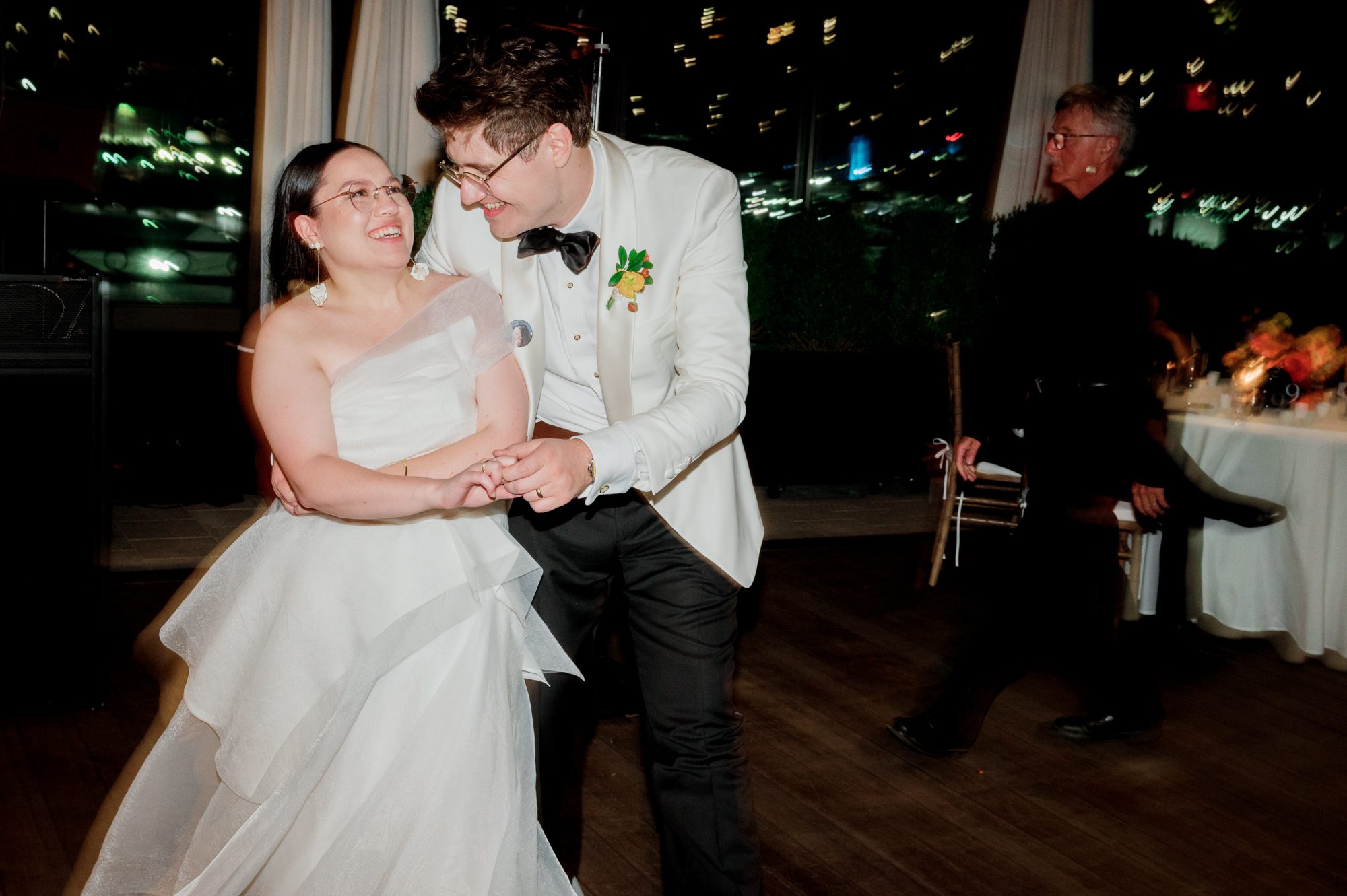 So excited for Erika and Andrei’s wedding day at The Box House Hotel in Brooklyn, NY. This boutique hotel had been on my bucket list for a while, and it did not disappoint! With its unique design, vibrant personality, and incredible rooftop views, The Box House Hotel provided the perfect setting for unique wedding celebration.
The day began with Erika and Andrei getting ready in their respective rooms, surrounded by friends and loved ones. One of the standout features of The Box House Hotel is its boutique charm and eclectic style, blending industrial elements with a cozy, artistic vibe. Erika’s bridal suite, with its floor-to-ceiling windows, was filled with natural light, making it a dream space for capturing those intimate getting-ready moments.
Once everyone was ready, Andrei headed to the rooftop, eagerly waiting to see his bride for the first time. As Erika gracefully approached, her dress swaying in the breeze, Andrei turned around, completely captivated. The two shared a private, heartfelt moment, whispering sweet words to each other, before we moved on to family photos.
The Box House Hotel’s location on a quiet Brooklyn street was perfect for photos. We captured their formal family and bridal party shots right in front of the hotel, showcasing its charming exterior. Then came a unique tradition I’d never witnessed before in my 14+ years of wedding photography! Erika and Andrei brought out a bucket of water filled with coins, and as guests cheered, Erika kicked the bucket as far as she could—a cultural ritual symbolizing good luck and prosperity. It was a joy to photograph and such a fun, memorable moment!
Afterward, we made our way back to the 10,000-square-foot rooftop, which offers unparalleled panoramic views of Manhattan, Brooklyn, and Long Island City. It’s a breathtaking setting for any wedding, leaving guests in awe of the skyline. Friends and family traveled from near and far, including Japan and Romania, to celebrate Erika and Andrei. To honor Erika's Japanese roots, Erika and Andrei incorporated a Japanese tea ceremony officiated by Erika's cousins from Japan. The rooftop was filled with laughter, love, and joy as the ceremony unfolded under the open sky.
As the sun set, the magic of the evening truly came alive. The city skyline twinkled with lights, and the dark sky sparkled with stars. Erika and Andrei danced, laughed, and celebrated late into the night, surrounded by their closest friends and family.
The Box House Hotel is a one-of-a-kind venue, blending urban sophistication with artistic charm. Its rooftop views, boutique-style accommodations, and vibrant atmosphere make it a perfect choice for couples looking to create a unique and unforgettable wedding experience.
Erika and Andrei, thank you for letting me be part of your incredible day. Wishing you a lifetime of love, happiness, and adventure!
Erika and Andrei The Box House Hotel Brooklyn NY Wedding documented by Karis from Hey Karis New York, Brooklyn, Hudson Valley NY and Catskills NY and NJ Wedding and NYC Elopement Photographer.