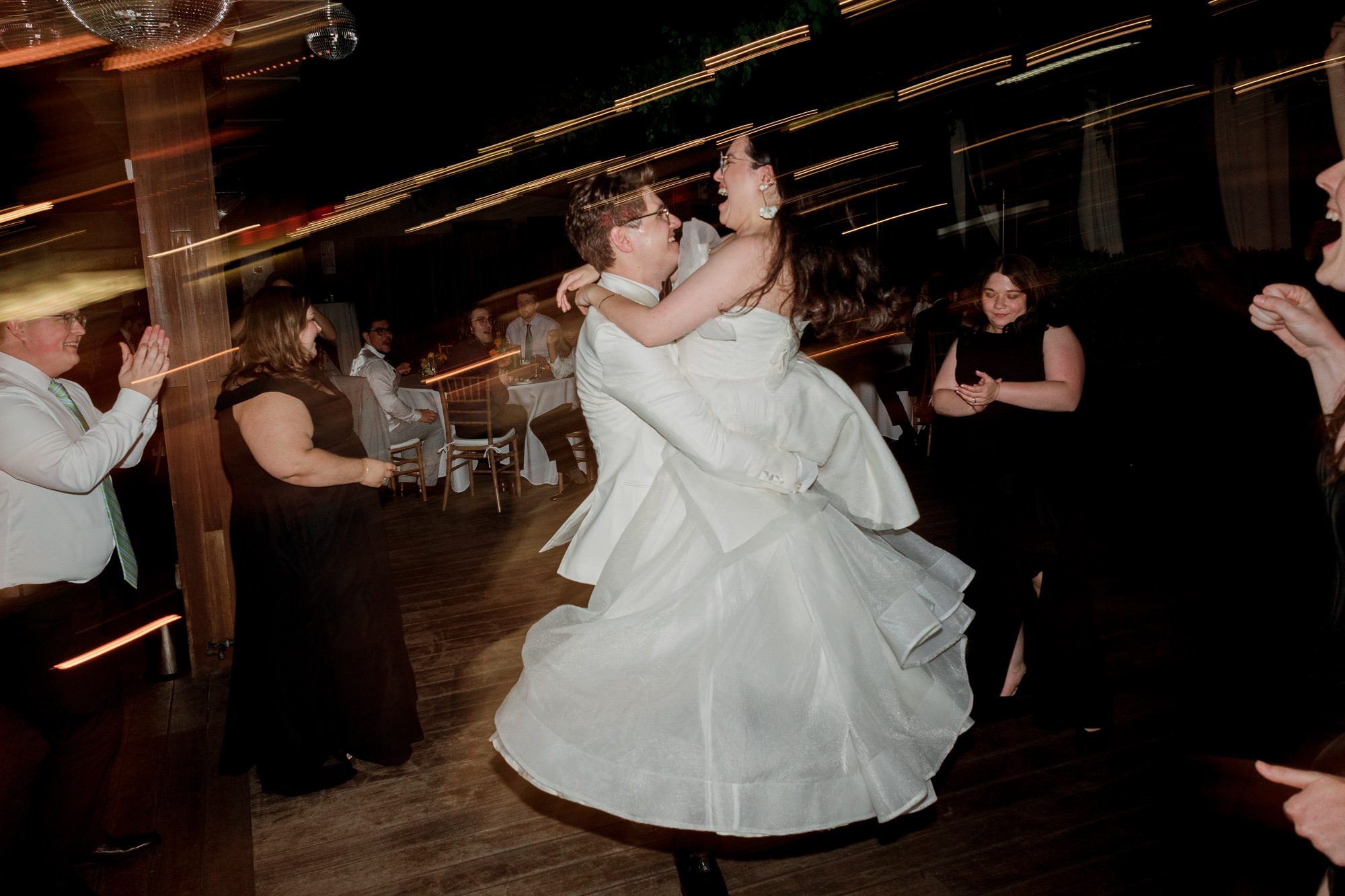So excited for Erika and Andrei’s wedding day at The Box House Hotel in Brooklyn, NY. This boutique hotel had been on my bucket list for a while, and it did not disappoint! With its unique design, vibrant personality, and incredible rooftop views, The Box House Hotel provided the perfect setting for unique wedding celebration.
The day began with Erika and Andrei getting ready in their respective rooms, surrounded by friends and loved ones. One of the standout features of The Box House Hotel is its boutique charm and eclectic style, blending industrial elements with a cozy, artistic vibe. Erika’s bridal suite, with its floor-to-ceiling windows, was filled with natural light, making it a dream space for capturing those intimate getting-ready moments.
Once everyone was ready, Andrei headed to the rooftop, eagerly waiting to see his bride for the first time. As Erika gracefully approached, her dress swaying in the breeze, Andrei turned around, completely captivated. The two shared a private, heartfelt moment, whispering sweet words to each other, before we moved on to family photos.
The Box House Hotel’s location on a quiet Brooklyn street was perfect for photos. We captured their formal family and bridal party shots right in front of the hotel, showcasing its charming exterior. Then came a unique tradition I’d never witnessed before in my 14+ years of wedding photography! Erika and Andrei brought out a bucket of water filled with coins, and as guests cheered, Erika kicked the bucket as far as she could—a cultural ritual symbolizing good luck and prosperity. It was a joy to photograph and such a fun, memorable moment!
Afterward, we made our way back to the 10,000-square-foot rooftop, which offers unparalleled panoramic views of Manhattan, Brooklyn, and Long Island City. It’s a breathtaking setting for any wedding, leaving guests in awe of the skyline. Friends and family traveled from near and far, including Japan and Romania, to celebrate Erika and Andrei. To honor Erika's Japanese roots, Erika and Andrei incorporated a Japanese tea ceremony officiated by Erika's cousins from Japan. The rooftop was filled with laughter, love, and joy as the ceremony unfolded under the open sky.
As the sun set, the magic of the evening truly came alive. The city skyline twinkled with lights, and the dark sky sparkled with stars. Erika and Andrei danced, laughed, and celebrated late into the night, surrounded by their closest friends and family.
The Box House Hotel is a one-of-a-kind venue, blending urban sophistication with artistic charm. Its rooftop views, boutique-style accommodations, and vibrant atmosphere make it a perfect choice for couples looking to create a unique and unforgettable wedding experience.
Erika and Andrei, thank you for letting me be part of your incredible day. Wishing you a lifetime of love, happiness, and adventure!
Erika and Andrei The Box House Hotel Brooklyn NY Wedding documented by Karis from Hey Karis New York, Brooklyn, Hudson Valley NY and Catskills NY and NJ Wedding and NYC Elopement Photographer.