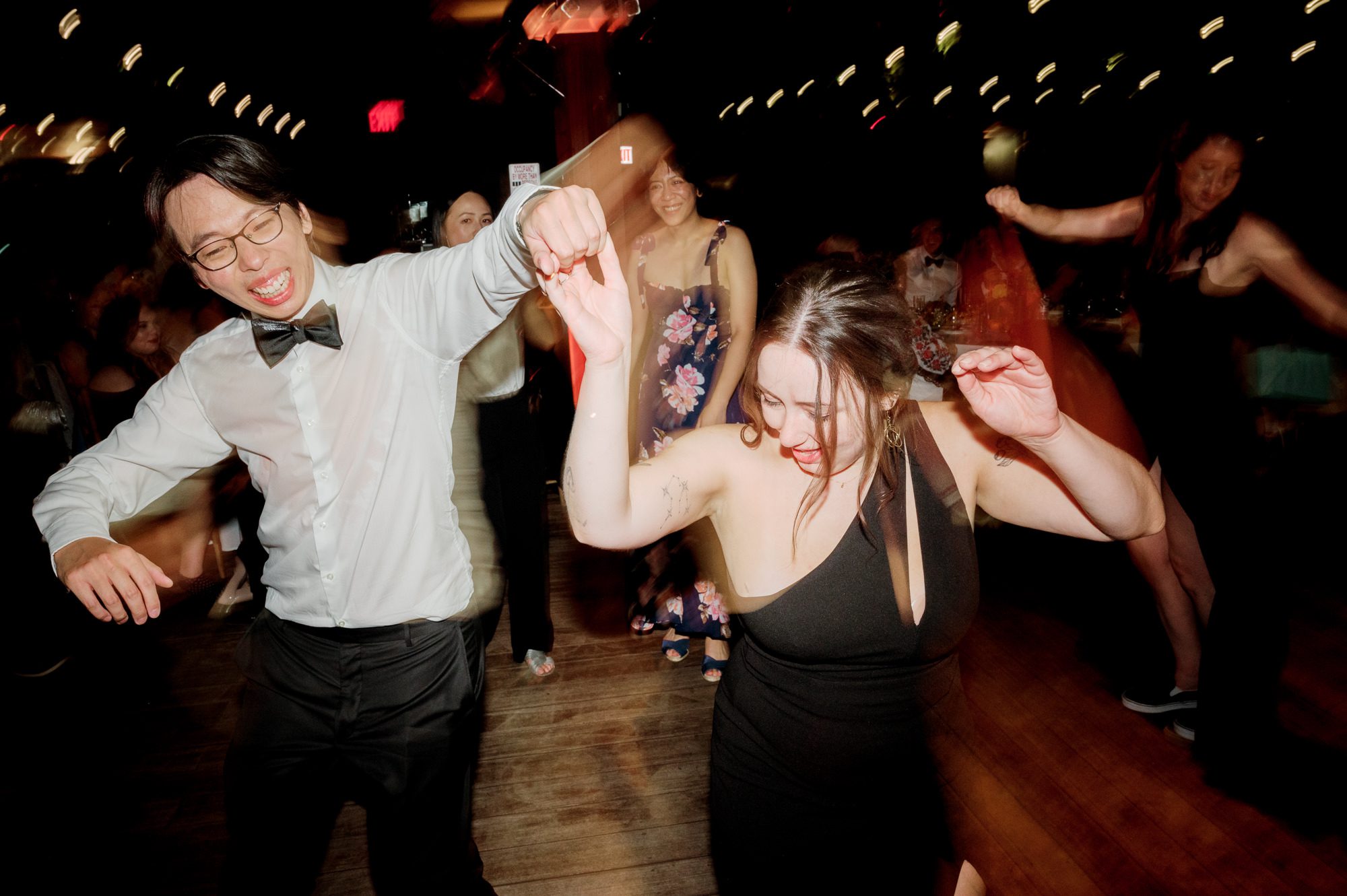 So excited for Erika and Andrei’s wedding day at The Box House Hotel in Brooklyn, NY. This boutique hotel had been on my bucket list for a while, and it did not disappoint! With its unique design, vibrant personality, and incredible rooftop views, The Box House Hotel provided the perfect setting for unique wedding celebration.
The day began with Erika and Andrei getting ready in their respective rooms, surrounded by friends and loved ones. One of the standout features of The Box House Hotel is its boutique charm and eclectic style, blending industrial elements with a cozy, artistic vibe. Erika’s bridal suite, with its floor-to-ceiling windows, was filled with natural light, making it a dream space for capturing those intimate getting-ready moments.
Once everyone was ready, Andrei headed to the rooftop, eagerly waiting to see his bride for the first time. As Erika gracefully approached, her dress swaying in the breeze, Andrei turned around, completely captivated. The two shared a private, heartfelt moment, whispering sweet words to each other, before we moved on to family photos.
The Box House Hotel’s location on a quiet Brooklyn street was perfect for photos. We captured their formal family and bridal party shots right in front of the hotel, showcasing its charming exterior. Then came a unique tradition I’d never witnessed before in my 14+ years of wedding photography! Erika and Andrei brought out a bucket of water filled with coins, and as guests cheered, Erika kicked the bucket as far as she could—a cultural ritual symbolizing good luck and prosperity. It was a joy to photograph and such a fun, memorable moment!
Afterward, we made our way back to the 10,000-square-foot rooftop, which offers unparalleled panoramic views of Manhattan, Brooklyn, and Long Island City. It’s a breathtaking setting for any wedding, leaving guests in awe of the skyline. Friends and family traveled from near and far, including Japan and Romania, to celebrate Erika and Andrei. To honor Erika's Japanese roots, Erika and Andrei incorporated a Japanese tea ceremony officiated by Erika's cousins from Japan. The rooftop was filled with laughter, love, and joy as the ceremony unfolded under the open sky.
As the sun set, the magic of the evening truly came alive. The city skyline twinkled with lights, and the dark sky sparkled with stars. Erika and Andrei danced, laughed, and celebrated late into the night, surrounded by their closest friends and family.
The Box House Hotel is a one-of-a-kind venue, blending urban sophistication with artistic charm. Its rooftop views, boutique-style accommodations, and vibrant atmosphere make it a perfect choice for couples looking to create a unique and unforgettable wedding experience.
Erika and Andrei, thank you for letting me be part of your incredible day. Wishing you a lifetime of love, happiness, and adventure!
Erika and Andrei The Box House Hotel Brooklyn NY Wedding documented by Karis from Hey Karis New York, Brooklyn, Hudson Valley NY and Catskills NY and NJ Wedding and NYC Elopement Photographer.