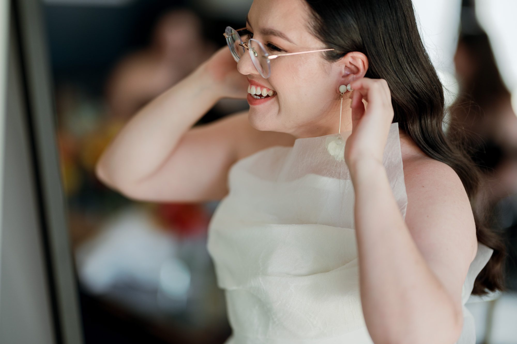 So excited for Erika and Andrei’s wedding day at The Box House Hotel in Brooklyn, NY. This boutique hotel had been on my bucket list for a while, and it did not disappoint! With its unique design, vibrant personality, and incredible rooftop views, The Box House Hotel provided the perfect setting for unique wedding celebration.
The day began with Erika and Andrei getting ready in their respective rooms, surrounded by friends and loved ones. One of the standout features of The Box House Hotel is its boutique charm and eclectic style, blending industrial elements with a cozy, artistic vibe. Erika’s bridal suite, with its floor-to-ceiling windows, was filled with natural light, making it a dream space for capturing those intimate getting-ready moments.
Once everyone was ready, Andrei headed to the rooftop, eagerly waiting to see his bride for the first time. As Erika gracefully approached, her dress swaying in the breeze, Andrei turned around, completely captivated. The two shared a private, heartfelt moment, whispering sweet words to each other, before we moved on to family photos.
The Box House Hotel’s location on a quiet Brooklyn street was perfect for photos. We captured their formal family and bridal party shots right in front of the hotel, showcasing its charming exterior. Then came a unique tradition I’d never witnessed before in my 14+ years of wedding photography! Erika and Andrei brought out a bucket of water filled with coins, and as guests cheered, Erika kicked the bucket as far as she could—a cultural ritual symbolizing good luck and prosperity. It was a joy to photograph and such a fun, memorable moment!
Afterward, we made our way back to the 10,000-square-foot rooftop, which offers unparalleled panoramic views of Manhattan, Brooklyn, and Long Island City. It’s a breathtaking setting for any wedding, leaving guests in awe of the skyline. Friends and family traveled from near and far, including Japan and Romania, to celebrate Erika and Andrei. To honor Erika's Japanese roots, Erika and Andrei incorporated a Japanese tea ceremony officiated by Erika's cousins from Japan. The rooftop was filled with laughter, love, and joy as the ceremony unfolded under the open sky.
As the sun set, the magic of the evening truly came alive. The city skyline twinkled with lights, and the dark sky sparkled with stars. Erika and Andrei danced, laughed, and celebrated late into the night, surrounded by their closest friends and family.
The Box House Hotel is a one-of-a-kind venue, blending urban sophistication with artistic charm. Its rooftop views, boutique-style accommodations, and vibrant atmosphere make it a perfect choice for couples looking to create a unique and unforgettable wedding experience.
Erika and Andrei, thank you for letting me be part of your incredible day. Wishing you a lifetime of love, happiness, and adventure!
Erika and Andrei The Box House Hotel Brooklyn NY Wedding documented by Karis from Hey Karis New York, Brooklyn, Hudson Valley NY and Catskills NY and NJ Wedding and NYC Elopement Photographer.