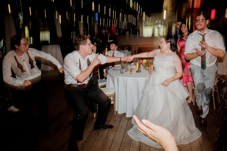 So excited for Erika and Andrei’s wedding day at The Box House Hotel in Brooklyn, NY. This boutique hotel had been on my bucket list for a while, and it did not disappoint! With its unique design, vibrant personality, and incredible rooftop views, The Box House Hotel provided the perfect setting for unique wedding celebration.
The day began with Erika and Andrei getting ready in their respective rooms, surrounded by friends and loved ones. One of the standout features of The Box House Hotel is its boutique charm and eclectic style, blending industrial elements with a cozy, artistic vibe. Erika’s bridal suite, with its floor-to-ceiling windows, was filled with natural light, making it a dream space for capturing those intimate getting-ready moments.
Once everyone was ready, Andrei headed to the rooftop, eagerly waiting to see his bride for the first time. As Erika gracefully approached, her dress swaying in the breeze, Andrei turned around, completely captivated. The two shared a private, heartfelt moment, whispering sweet words to each other, before we moved on to family photos.
The Box House Hotel’s location on a quiet Brooklyn street was perfect for photos. We captured their formal family and bridal party shots right in front of the hotel, showcasing its charming exterior. Then came a unique tradition I’d never witnessed before in my 14+ years of wedding photography! Erika and Andrei brought out a bucket of water filled with coins, and as guests cheered, Erika kicked the bucket as far as she could—a cultural ritual symbolizing good luck and prosperity. It was a joy to photograph and such a fun, memorable moment!
Afterward, we made our way back to the 10,000-square-foot rooftop, which offers unparalleled panoramic views of Manhattan, Brooklyn, and Long Island City. It’s a breathtaking setting for any wedding, leaving guests in awe of the skyline. Friends and family traveled from near and far, including Japan and Romania, to celebrate Erika and Andrei. To honor Erika's Japanese roots, Erika and Andrei incorporated a Japanese tea ceremony officiated by Erika's cousins from Japan. The rooftop was filled with laughter, love, and joy as the ceremony unfolded under the open sky.
As the sun set, the magic of the evening truly came alive. The city skyline twinkled with lights, and the dark sky sparkled with stars. Erika and Andrei danced, laughed, and celebrated late into the night, surrounded by their closest friends and family.
The Box House Hotel is a one-of-a-kind venue, blending urban sophistication with artistic charm. Its rooftop views, boutique-style accommodations, and vibrant atmosphere make it a perfect choice for couples looking to create a unique and unforgettable wedding experience.
Erika and Andrei, thank you for letting me be part of your incredible day. Wishing you a lifetime of love, happiness, and adventure!
Erika and Andrei The Box House Hotel Brooklyn NY Wedding documented by Karis from Hey Karis New York, Brooklyn, Hudson Valley NY and Catskills NY and NJ Wedding and NYC Elopement Photographer.