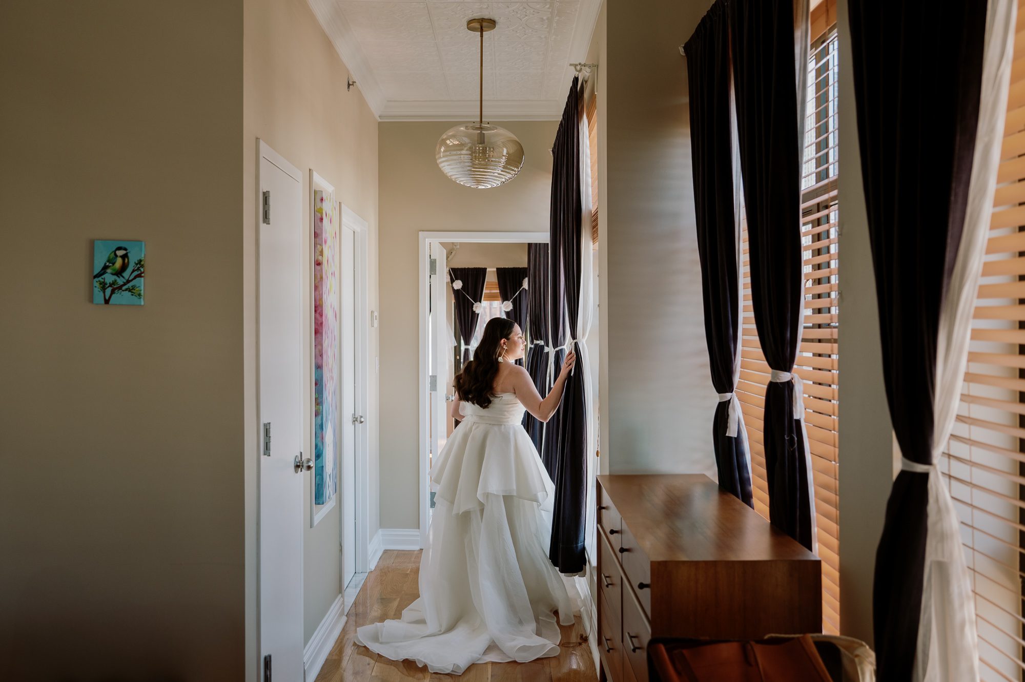 So excited for Erika and Andrei’s wedding day at The Box House Hotel in Brooklyn, NY. This boutique hotel had been on my bucket list for a while, and it did not disappoint! With its unique design, vibrant personality, and incredible rooftop views, The Box House Hotel provided the perfect setting for unique wedding celebration.
The day began with Erika and Andrei getting ready in their respective rooms, surrounded by friends and loved ones. One of the standout features of The Box House Hotel is its boutique charm and eclectic style, blending industrial elements with a cozy, artistic vibe. Erika’s bridal suite, with its floor-to-ceiling windows, was filled with natural light, making it a dream space for capturing those intimate getting-ready moments.
Once everyone was ready, Andrei headed to the rooftop, eagerly waiting to see his bride for the first time. As Erika gracefully approached, her dress swaying in the breeze, Andrei turned around, completely captivated. The two shared a private, heartfelt moment, whispering sweet words to each other, before we moved on to family photos.
The Box House Hotel’s location on a quiet Brooklyn street was perfect for photos. We captured their formal family and bridal party shots right in front of the hotel, showcasing its charming exterior. Then came a unique tradition I’d never witnessed before in my 14+ years of wedding photography! Erika and Andrei brought out a bucket of water filled with coins, and as guests cheered, Erika kicked the bucket as far as she could—a cultural ritual symbolizing good luck and prosperity. It was a joy to photograph and such a fun, memorable moment!
Afterward, we made our way back to the 10,000-square-foot rooftop, which offers unparalleled panoramic views of Manhattan, Brooklyn, and Long Island City. It’s a breathtaking setting for any wedding, leaving guests in awe of the skyline. Friends and family traveled from near and far, including Japan and Romania, to celebrate Erika and Andrei. To honor Erika's Japanese roots, Erika and Andrei incorporated a Japanese tea ceremony officiated by Erika's cousins from Japan. The rooftop was filled with laughter, love, and joy as the ceremony unfolded under the open sky.
As the sun set, the magic of the evening truly came alive. The city skyline twinkled with lights, and the dark sky sparkled with stars. Erika and Andrei danced, laughed, and celebrated late into the night, surrounded by their closest friends and family.
The Box House Hotel is a one-of-a-kind venue, blending urban sophistication with artistic charm. Its rooftop views, boutique-style accommodations, and vibrant atmosphere make it a perfect choice for couples looking to create a unique and unforgettable wedding experience.
Erika and Andrei, thank you for letting me be part of your incredible day. Wishing you a lifetime of love, happiness, and adventure!
Erika and Andrei The Box House Hotel Brooklyn NY Wedding documented by Karis from Hey Karis New York, Brooklyn, Hudson Valley NY and Catskills NY and NJ Wedding and NYC Elopement Photographer.