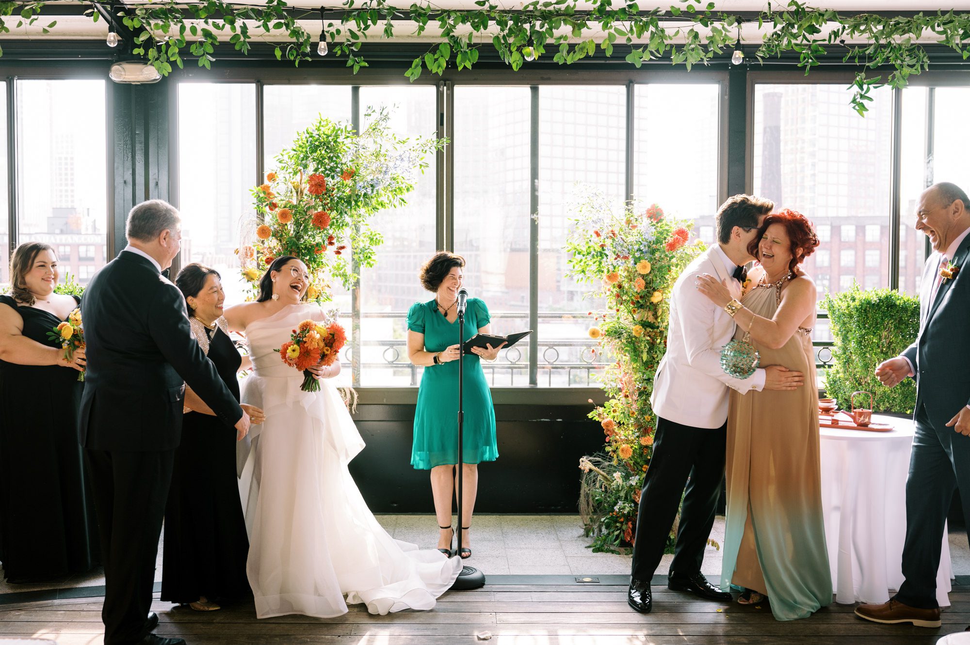 So excited for Erika and Andrei’s wedding day at The Box House Hotel in Brooklyn, NY. This boutique hotel had been on my bucket list for a while, and it did not disappoint! With its unique design, vibrant personality, and incredible rooftop views, The Box House Hotel provided the perfect setting for unique wedding celebration.
The day began with Erika and Andrei getting ready in their respective rooms, surrounded by friends and loved ones. One of the standout features of The Box House Hotel is its boutique charm and eclectic style, blending industrial elements with a cozy, artistic vibe. Erika’s bridal suite, with its floor-to-ceiling windows, was filled with natural light, making it a dream space for capturing those intimate getting-ready moments.
Once everyone was ready, Andrei headed to the rooftop, eagerly waiting to see his bride for the first time. As Erika gracefully approached, her dress swaying in the breeze, Andrei turned around, completely captivated. The two shared a private, heartfelt moment, whispering sweet words to each other, before we moved on to family photos.
The Box House Hotel’s location on a quiet Brooklyn street was perfect for photos. We captured their formal family and bridal party shots right in front of the hotel, showcasing its charming exterior. Then came a unique tradition I’d never witnessed before in my 14+ years of wedding photography! Erika and Andrei brought out a bucket of water filled with coins, and as guests cheered, Erika kicked the bucket as far as she could—a cultural ritual symbolizing good luck and prosperity. It was a joy to photograph and such a fun, memorable moment!
Afterward, we made our way back to the 10,000-square-foot rooftop, which offers unparalleled panoramic views of Manhattan, Brooklyn, and Long Island City. It’s a breathtaking setting for any wedding, leaving guests in awe of the skyline. Friends and family traveled from near and far, including Japan and Romania, to celebrate Erika and Andrei. To honor Erika's Japanese roots, Erika and Andrei incorporated a Japanese tea ceremony officiated by Erika's cousins from Japan. The rooftop was filled with laughter, love, and joy as the ceremony unfolded under the open sky.
As the sun set, the magic of the evening truly came alive. The city skyline twinkled with lights, and the dark sky sparkled with stars. Erika and Andrei danced, laughed, and celebrated late into the night, surrounded by their closest friends and family.
The Box House Hotel is a one-of-a-kind venue, blending urban sophistication with artistic charm. Its rooftop views, boutique-style accommodations, and vibrant atmosphere make it a perfect choice for couples looking to create a unique and unforgettable wedding experience.
Erika and Andrei, thank you for letting me be part of your incredible day. Wishing you a lifetime of love, happiness, and adventure!
Erika and Andrei The Box House Hotel Brooklyn NY Wedding documented by Karis from Hey Karis New York, Brooklyn, Hudson Valley NY and Catskills NY and NJ Wedding and NYC Elopement Photographer.