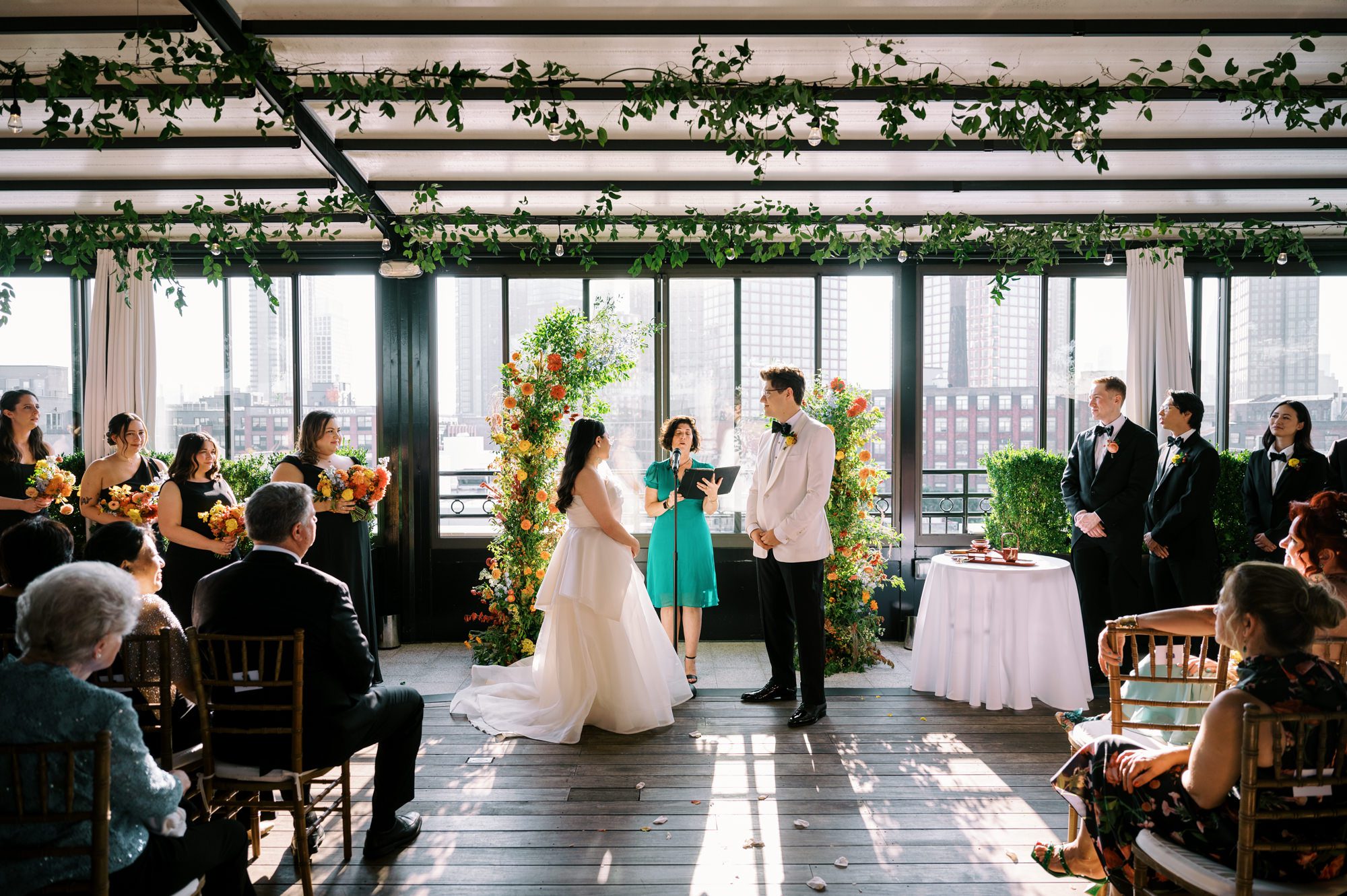 So excited for Erika and Andrei’s wedding day at The Box House Hotel in Brooklyn, NY. This boutique hotel had been on my bucket list for a while, and it did not disappoint! With its unique design, vibrant personality, and incredible rooftop views, The Box House Hotel provided the perfect setting for unique wedding celebration.
The day began with Erika and Andrei getting ready in their respective rooms, surrounded by friends and loved ones. One of the standout features of The Box House Hotel is its boutique charm and eclectic style, blending industrial elements with a cozy, artistic vibe. Erika’s bridal suite, with its floor-to-ceiling windows, was filled with natural light, making it a dream space for capturing those intimate getting-ready moments.
Once everyone was ready, Andrei headed to the rooftop, eagerly waiting to see his bride for the first time. As Erika gracefully approached, her dress swaying in the breeze, Andrei turned around, completely captivated. The two shared a private, heartfelt moment, whispering sweet words to each other, before we moved on to family photos.
The Box House Hotel’s location on a quiet Brooklyn street was perfect for photos. We captured their formal family and bridal party shots right in front of the hotel, showcasing its charming exterior. Then came a unique tradition I’d never witnessed before in my 14+ years of wedding photography! Erika and Andrei brought out a bucket of water filled with coins, and as guests cheered, Erika kicked the bucket as far as she could—a cultural ritual symbolizing good luck and prosperity. It was a joy to photograph and such a fun, memorable moment!
Afterward, we made our way back to the 10,000-square-foot rooftop, which offers unparalleled panoramic views of Manhattan, Brooklyn, and Long Island City. It’s a breathtaking setting for any wedding, leaving guests in awe of the skyline. Friends and family traveled from near and far, including Japan and Romania, to celebrate Erika and Andrei. To honor Erika's Japanese roots, Erika and Andrei incorporated a Japanese tea ceremony officiated by Erika's cousins from Japan. The rooftop was filled with laughter, love, and joy as the ceremony unfolded under the open sky.
As the sun set, the magic of the evening truly came alive. The city skyline twinkled with lights, and the dark sky sparkled with stars. Erika and Andrei danced, laughed, and celebrated late into the night, surrounded by their closest friends and family.
The Box House Hotel is a one-of-a-kind venue, blending urban sophistication with artistic charm. Its rooftop views, boutique-style accommodations, and vibrant atmosphere make it a perfect choice for couples looking to create a unique and unforgettable wedding experience.
Erika and Andrei, thank you for letting me be part of your incredible day. Wishing you a lifetime of love, happiness, and adventure!
Erika and Andrei The Box House Hotel Brooklyn NY Wedding documented by Karis from Hey Karis New York, Brooklyn, Hudson Valley NY and Catskills NY and NJ Wedding and NYC Elopement Photographer.