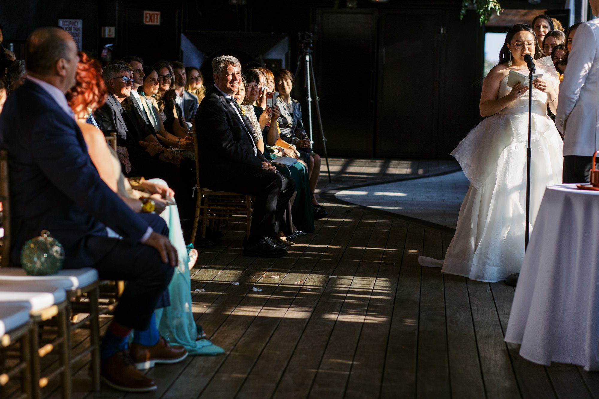 So excited for Erika and Andrei’s wedding day at The Box House Hotel in Brooklyn, NY. This boutique hotel had been on my bucket list for a while, and it did not disappoint! With its unique design, vibrant personality, and incredible rooftop views, The Box House Hotel provided the perfect setting for unique wedding celebration.
The day began with Erika and Andrei getting ready in their respective rooms, surrounded by friends and loved ones. One of the standout features of The Box House Hotel is its boutique charm and eclectic style, blending industrial elements with a cozy, artistic vibe. Erika’s bridal suite, with its floor-to-ceiling windows, was filled with natural light, making it a dream space for capturing those intimate getting-ready moments.
Once everyone was ready, Andrei headed to the rooftop, eagerly waiting to see his bride for the first time. As Erika gracefully approached, her dress swaying in the breeze, Andrei turned around, completely captivated. The two shared a private, heartfelt moment, whispering sweet words to each other, before we moved on to family photos.
The Box House Hotel’s location on a quiet Brooklyn street was perfect for photos. We captured their formal family and bridal party shots right in front of the hotel, showcasing its charming exterior. Then came a unique tradition I’d never witnessed before in my 14+ years of wedding photography! Erika and Andrei brought out a bucket of water filled with coins, and as guests cheered, Erika kicked the bucket as far as she could—a cultural ritual symbolizing good luck and prosperity. It was a joy to photograph and such a fun, memorable moment!
Afterward, we made our way back to the 10,000-square-foot rooftop, which offers unparalleled panoramic views of Manhattan, Brooklyn, and Long Island City. It’s a breathtaking setting for any wedding, leaving guests in awe of the skyline. Friends and family traveled from near and far, including Japan and Romania, to celebrate Erika and Andrei. To honor Erika's Japanese roots, Erika and Andrei incorporated a Japanese tea ceremony officiated by Erika's cousins from Japan. The rooftop was filled with laughter, love, and joy as the ceremony unfolded under the open sky.
As the sun set, the magic of the evening truly came alive. The city skyline twinkled with lights, and the dark sky sparkled with stars. Erika and Andrei danced, laughed, and celebrated late into the night, surrounded by their closest friends and family.
The Box House Hotel is a one-of-a-kind venue, blending urban sophistication with artistic charm. Its rooftop views, boutique-style accommodations, and vibrant atmosphere make it a perfect choice for couples looking to create a unique and unforgettable wedding experience.
Erika and Andrei, thank you for letting me be part of your incredible day. Wishing you a lifetime of love, happiness, and adventure!
Erika and Andrei The Box House Hotel Brooklyn NY Wedding documented by Karis from Hey Karis New York, Brooklyn, Hudson Valley NY and Catskills NY and NJ Wedding and NYC Elopement Photographer.