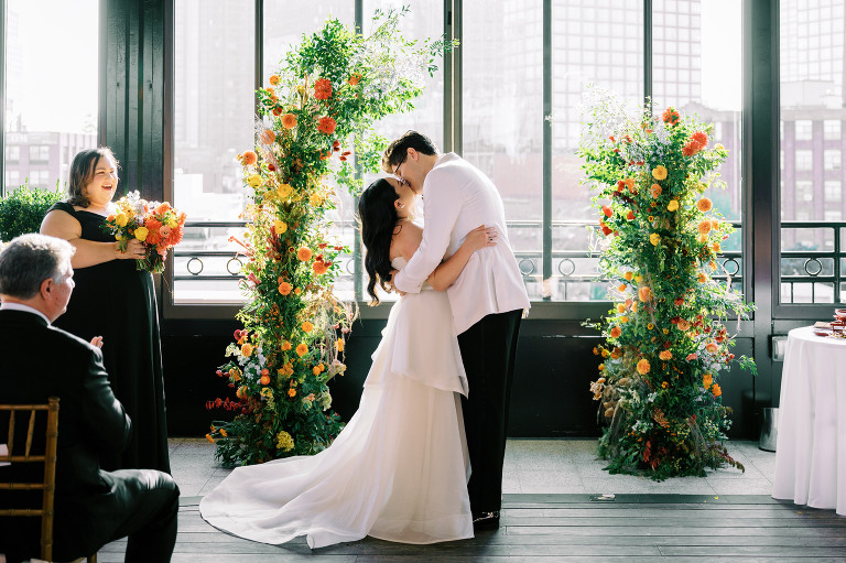 So excited for Erika and Andrei’s wedding day at The Box House Hotel in Brooklyn, NY. This boutique hotel had been on my bucket list for a while, and it did not disappoint! With its unique design, vibrant personality, and incredible rooftop views, The Box House Hotel provided the perfect setting for unique wedding celebration.
The day began with Erika and Andrei getting ready in their respective rooms, surrounded by friends and loved ones. One of the standout features of The Box House Hotel is its boutique charm and eclectic style, blending industrial elements with a cozy, artistic vibe. Erika’s bridal suite, with its floor-to-ceiling windows, was filled with natural light, making it a dream space for capturing those intimate getting-ready moments.
Once everyone was ready, Andrei headed to the rooftop, eagerly waiting to see his bride for the first time. As Erika gracefully approached, her dress swaying in the breeze, Andrei turned around, completely captivated. The two shared a private, heartfelt moment, whispering sweet words to each other, before we moved on to family photos.
The Box House Hotel’s location on a quiet Brooklyn street was perfect for photos. We captured their formal family and bridal party shots right in front of the hotel, showcasing its charming exterior. Then came a unique tradition I’d never witnessed before in my 14+ years of wedding photography! Erika and Andrei brought out a bucket of water filled with coins, and as guests cheered, Erika kicked the bucket as far as she could—a cultural ritual symbolizing good luck and prosperity. It was a joy to photograph and such a fun, memorable moment!
Afterward, we made our way back to the 10,000-square-foot rooftop, which offers unparalleled panoramic views of Manhattan, Brooklyn, and Long Island City. It’s a breathtaking setting for any wedding, leaving guests in awe of the skyline. Friends and family traveled from near and far, including Japan and Romania, to celebrate Erika and Andrei. To honor Erika's Japanese roots, Erika and Andrei incorporated a Japanese tea ceremony officiated by Erika's cousins from Japan. The rooftop was filled with laughter, love, and joy as the ceremony unfolded under the open sky.
As the sun set, the magic of the evening truly came alive. The city skyline twinkled with lights, and the dark sky sparkled with stars. Erika and Andrei danced, laughed, and celebrated late into the night, surrounded by their closest friends and family.
The Box House Hotel is a one-of-a-kind venue, blending urban sophistication with artistic charm. Its rooftop views, boutique-style accommodations, and vibrant atmosphere make it a perfect choice for couples looking to create a unique and unforgettable wedding experience.
Erika and Andrei, thank you for letting me be part of your incredible day. Wishing you a lifetime of love, happiness, and adventure!
Erika and Andrei The Box House Hotel Brooklyn NY Wedding documented by Karis from Hey Karis New York, Brooklyn, Hudson Valley NY and Catskills NY and NJ Wedding and NYC Elopement Photographer.